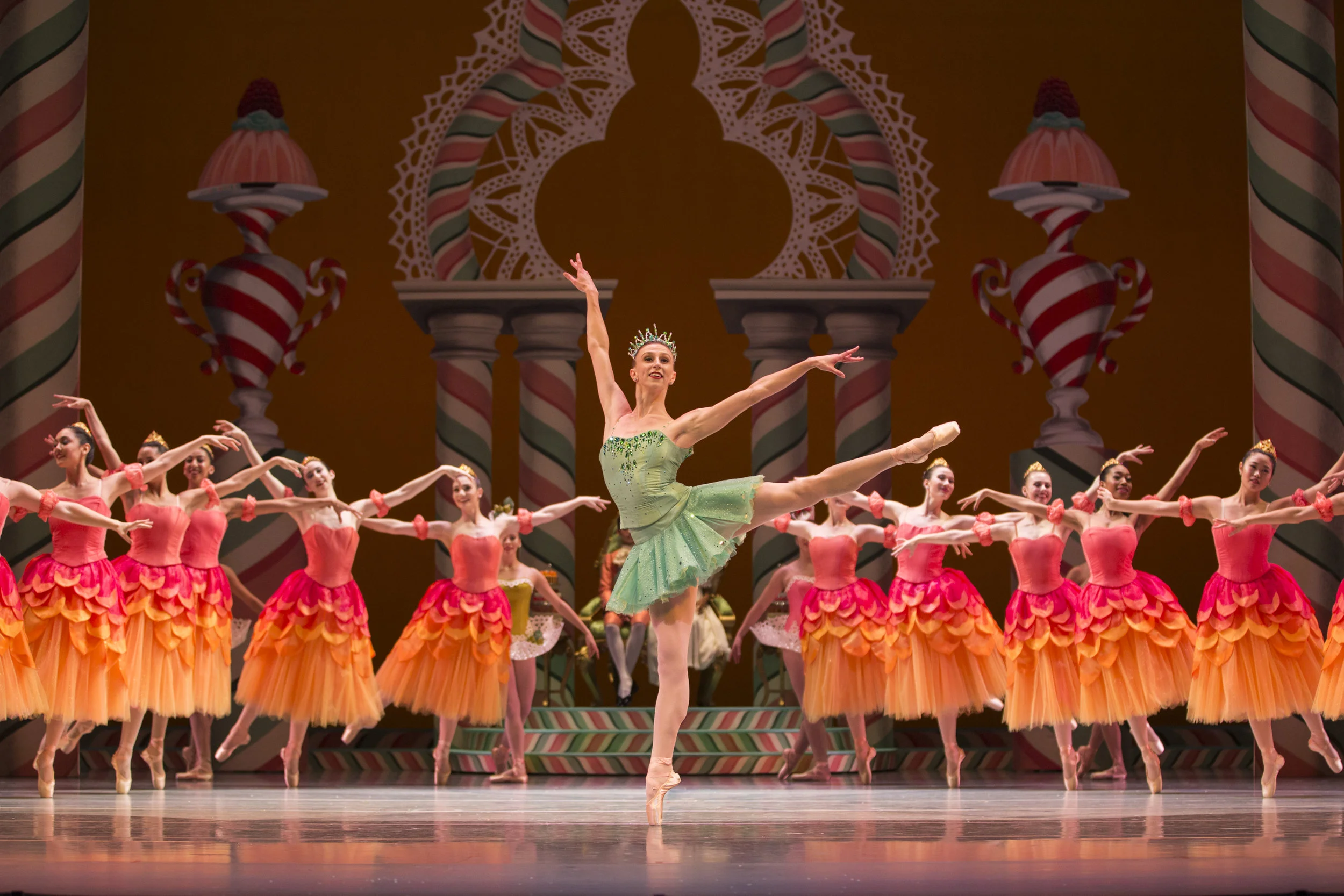 Pacific Northwest Ballet corps de ballet dancer Elle Macy as Dewdrop, with company dancers in a scene from George Balanchine’s The Nutcracker®, choreographed by George Balanchine © The George Balanchine Trust. PNB’s production features sets and costumes designed by children’s author and illustrator Ian Falconer (Olivia the Pig) and runs November 24 – December 28, 2017. Photo © Angela Sterling.