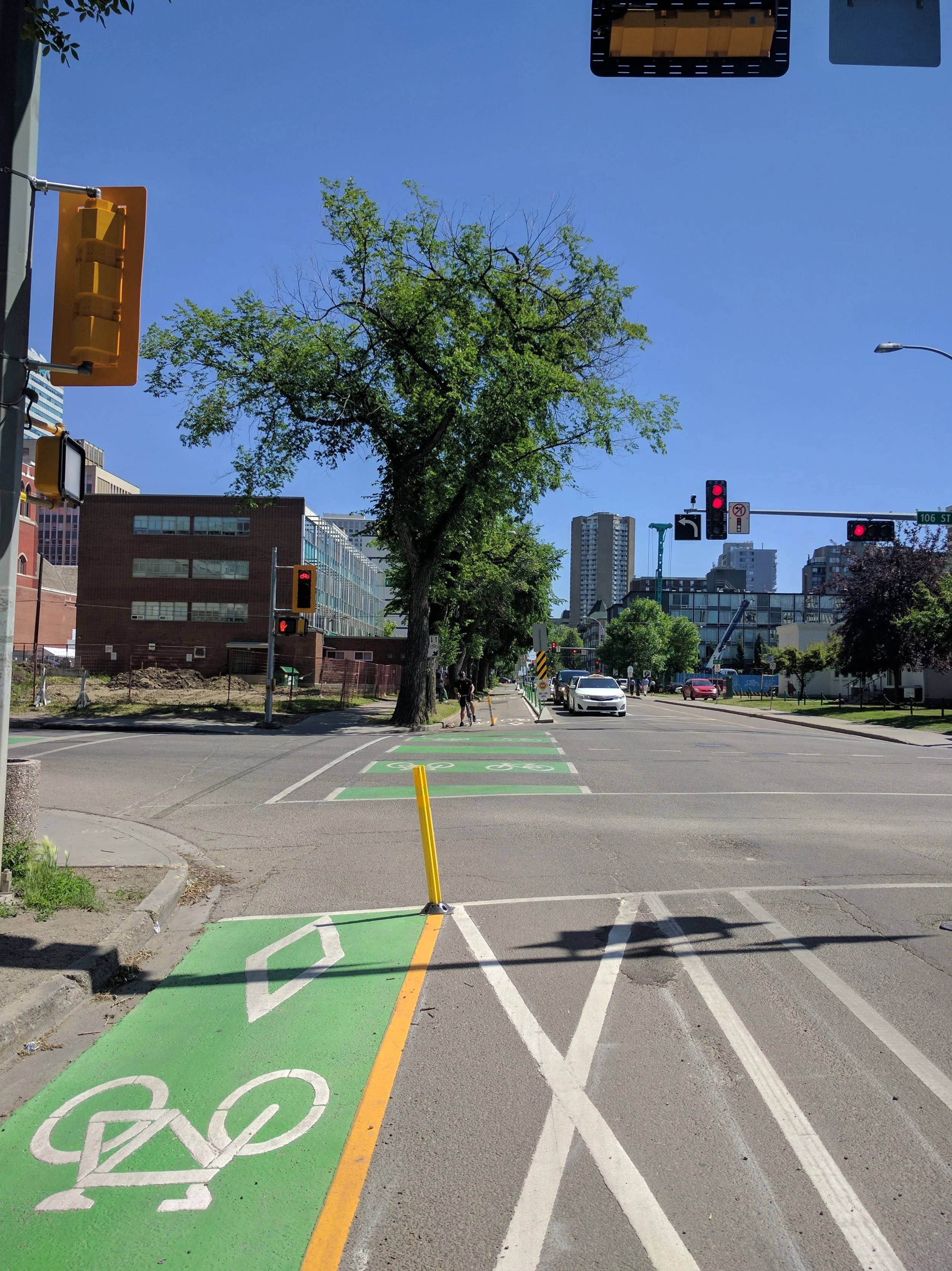 New bike lanes on 100th avenue in downtown Edmonton. Photo credit: Helen Frost.