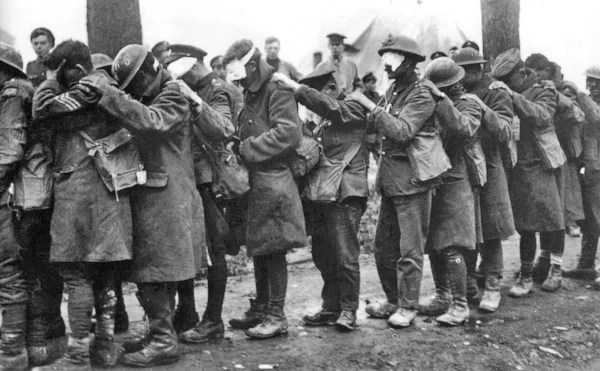 Image from Wikimedia Commons ; British 55th (West Lancashire) Division troops blinded by tear gas await treatment at an Advanced Dressing Station near Bethune during the Battle of Estaires , 10 April 1918, part of the German offensive in Flanders.