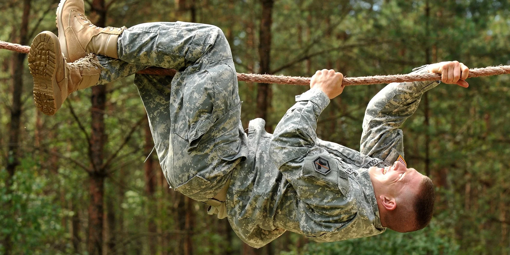 U.S. Army Sgt. Timothy Collins, 66th Military Intelligence Brigade, goes across the rope bridge at the obstacle course during United States Army Europe's Best Warrior Competition in Grafenwoehr, Germany, July 30, 2012. Image from Wikimedia Commons (U.S. Army photo by Visual Information Specialist Markus Rauchenberger/Released).