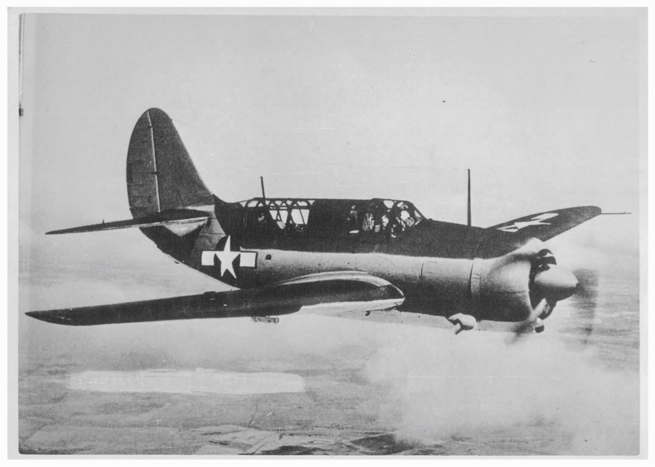 A Curtiss SB2C Helldiver , the same model as the one flown by Raymond Porter and Normand Roland Brissette, who made an emergency landing on the sea being hit by the anti-aircraft fire while attacking the Heavy Cruiser Tone .