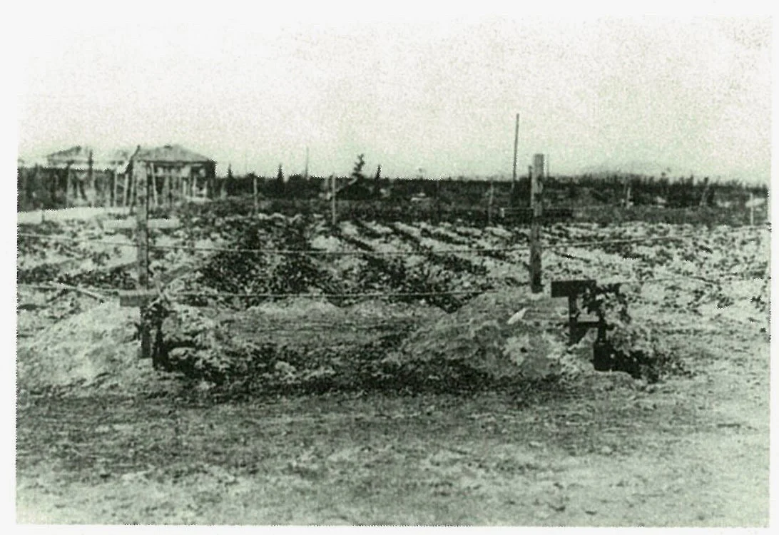 The graves of Ralph J. Neal (left, the shorter one) and Normand Roland Brissette (right, the taller one), which had been located in Ujina, Minami-Ward, Hiroshima City. On the wooden markers is written “Grave of a US Soldier”. The two bodies of the f…