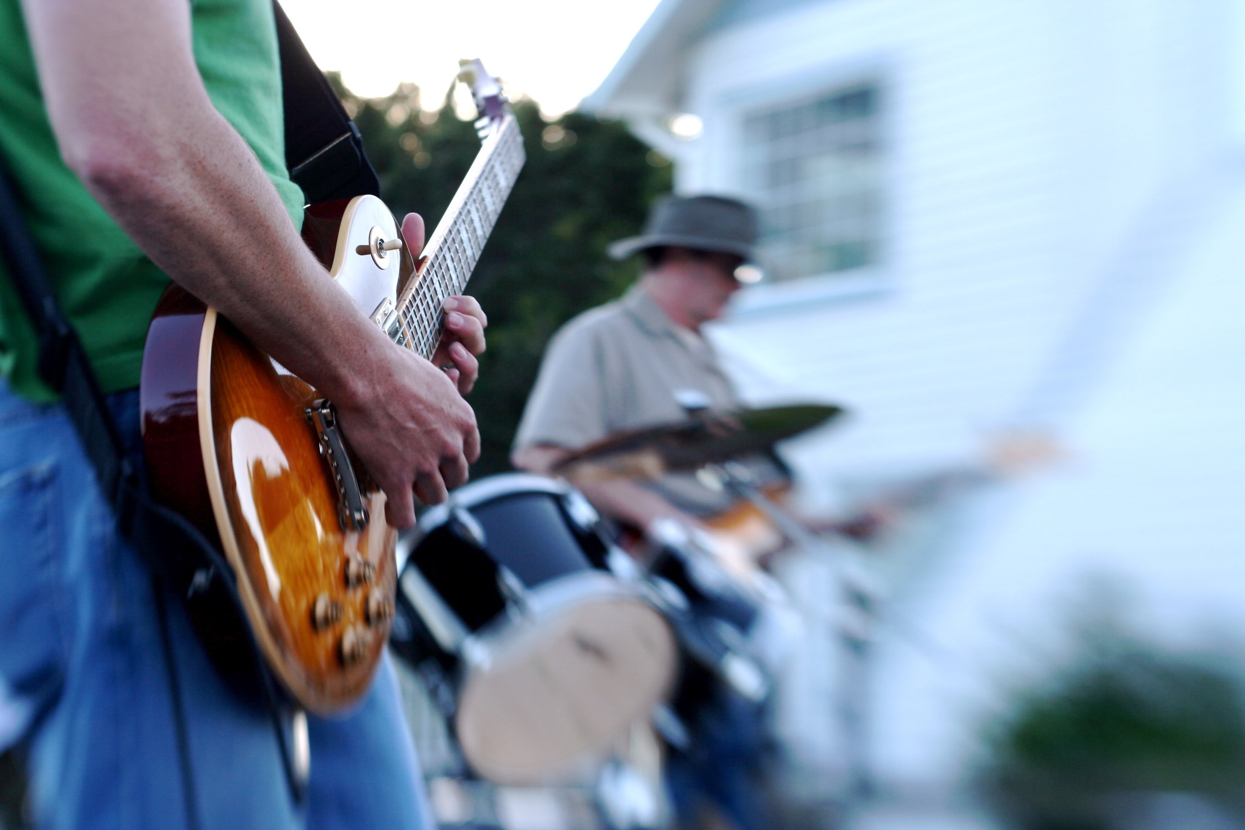A Lensbaby was used to capture this photo of a band member riffing on his guitar.