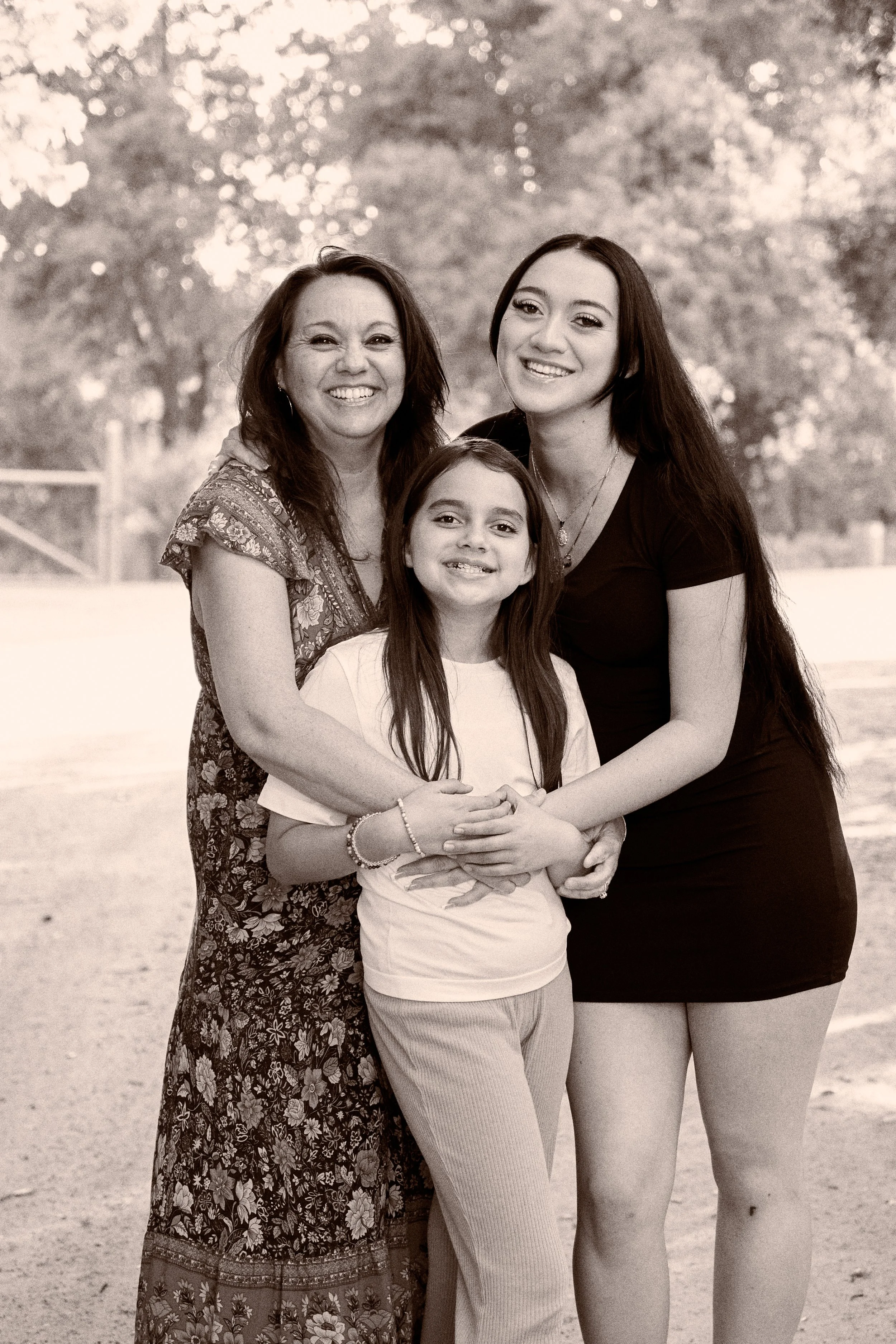 Libby Martin posing with her two daughters. Photo taken by Luis Martinez of Luis Martinez Photography in Santa Ana, CA