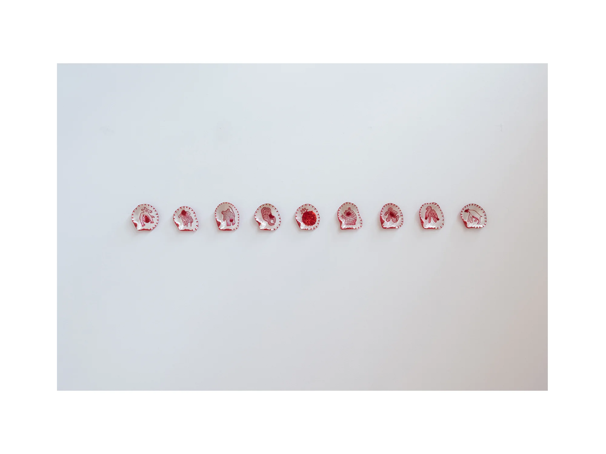 Stephen Eastaugh S.W.A.T.T. Scholarly Weapon and Tactic Toys, 2016 etched pearl shells, cotton and silk thread 12 x 13cm each ARTIST BIO