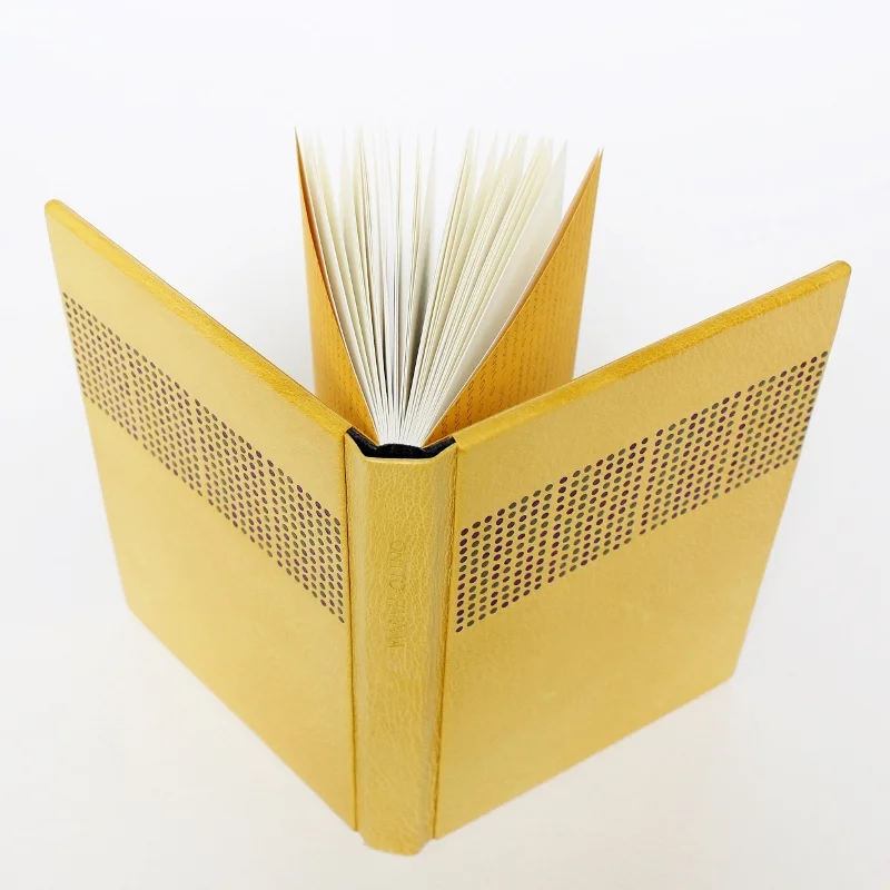 Sewn boards binding in fine goat skin by Kaija Rantakari, 2016. The binding features 768 binary code leather onlays and typed endpapers with the information of the title, author, and publisher of the book: Ontto harmaa by Olli-Pekka Tennilä, published by Poesia, 2016 - paperiaarre.com