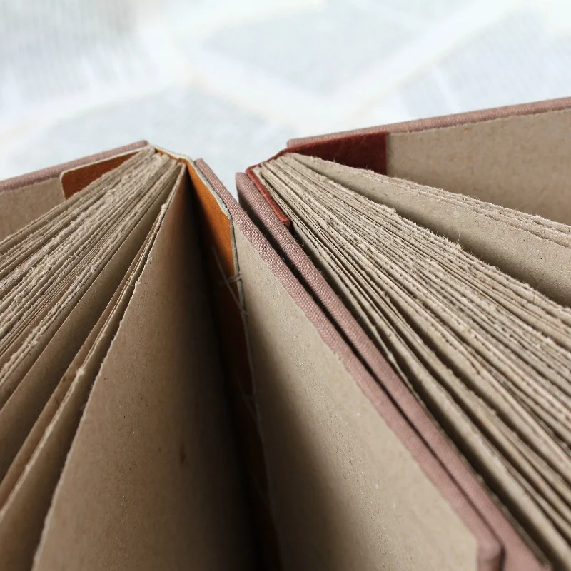 coptic notebooks with leather spines, handmade by Kaija Rantakari / www.paperiaarre.com