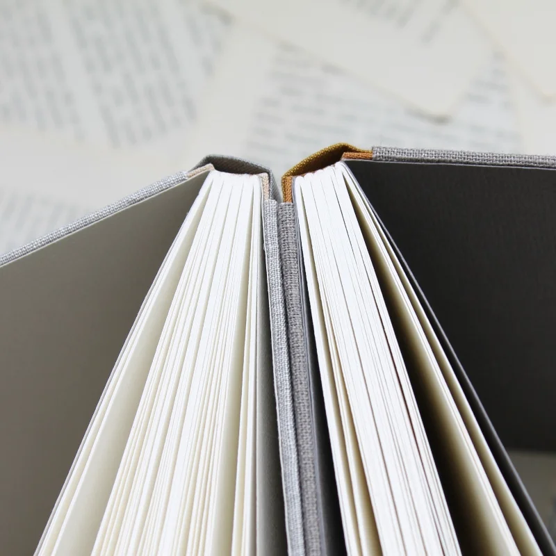 small handmade notebooks by Kaija Rantakari - sewn boards binding with linen / book cloth covers - www.paperiaarre.com