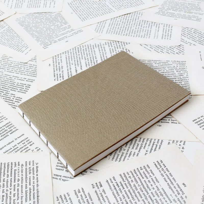 softcover Coptic bound guest book with gold linen covers - handmade by Kaija Rantakari / www.paperiaarre.com
