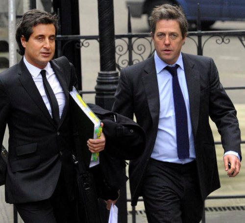 Smeared? Actor Hugh Grant (r) arrives at the Leveson Inquiry with barrister David Sherborne.