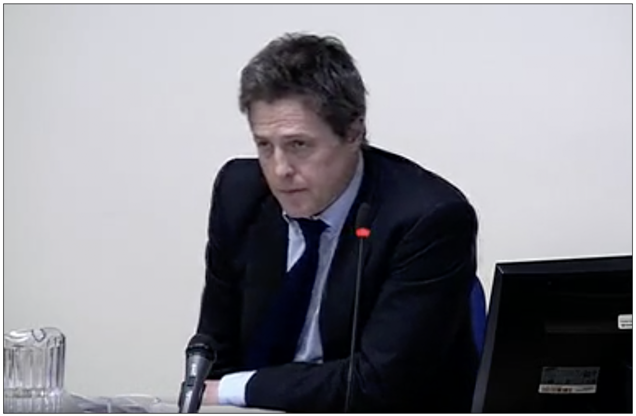 Evidence: Hugh Grant answering questions at the Leveson Inquiry in 2011
