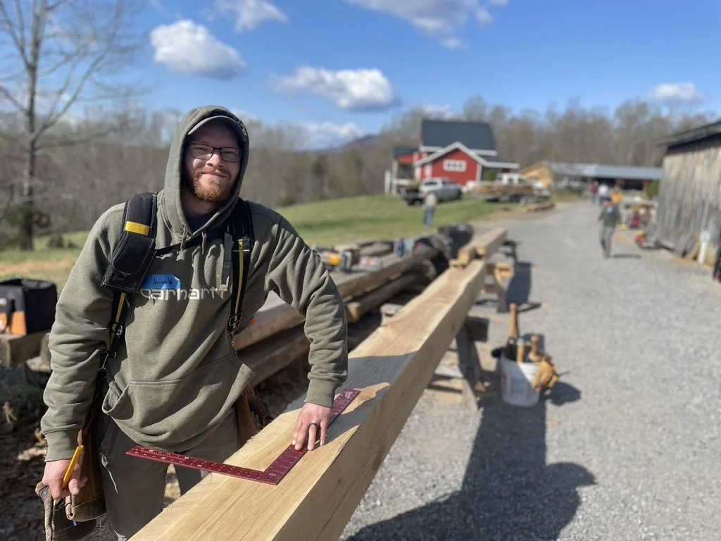 SBWI TImber Framing student working to layout a long timber in a carpentry class