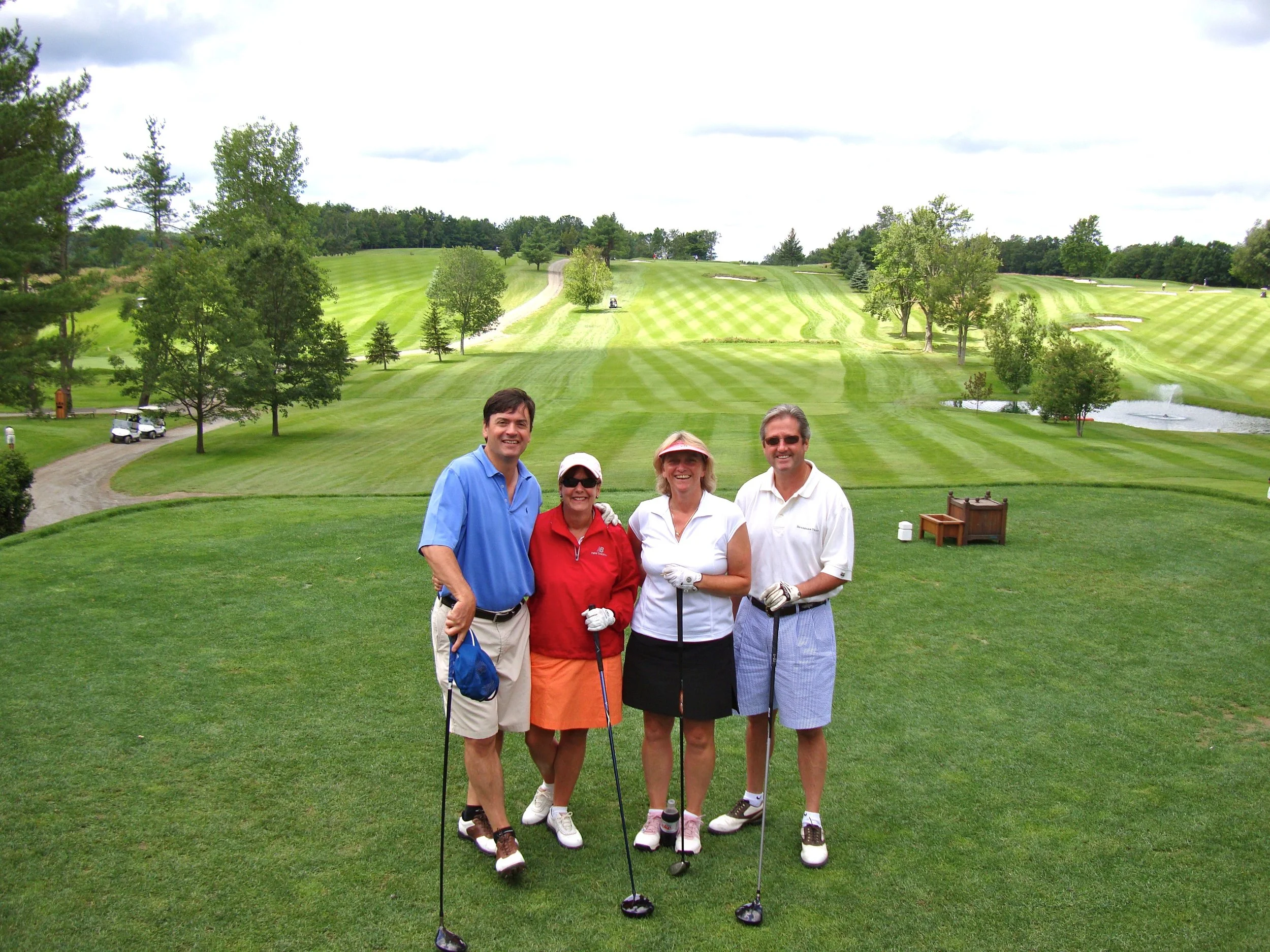 With our dear friends Clarke and Trish at the opening hole.