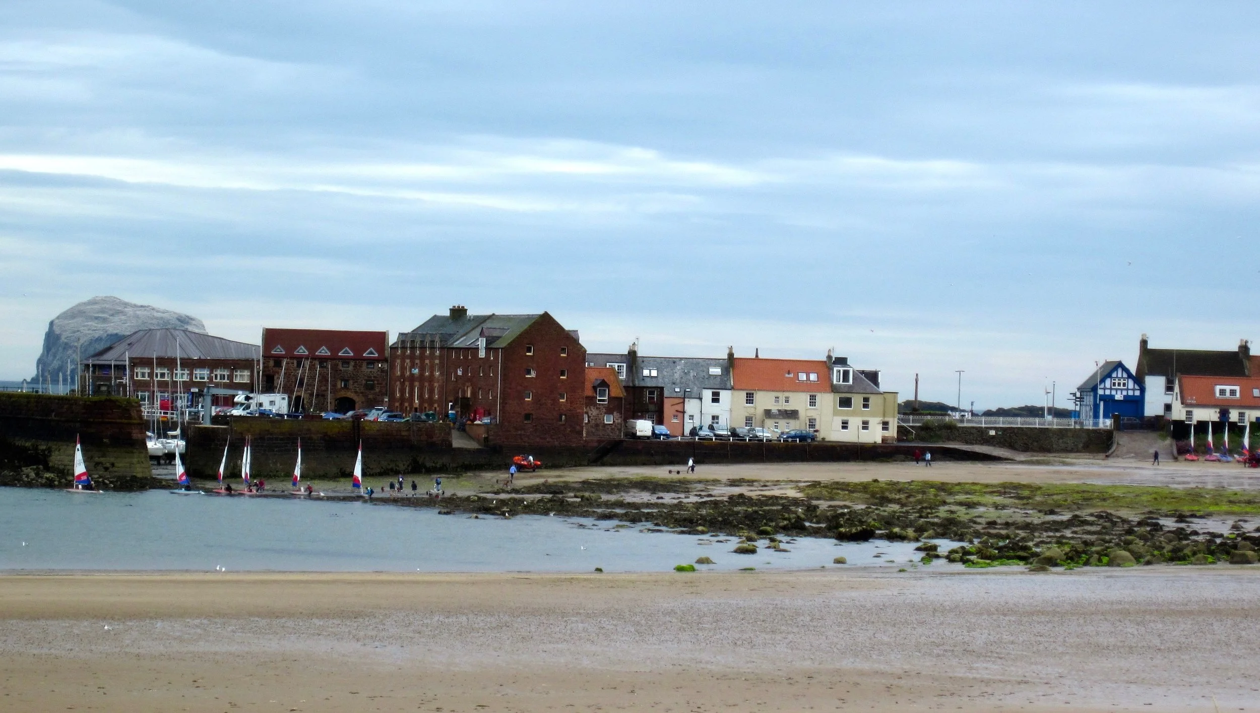 A view of the harbor part of town with the Bass Rock in the background, taken from the first tee at NBGC.