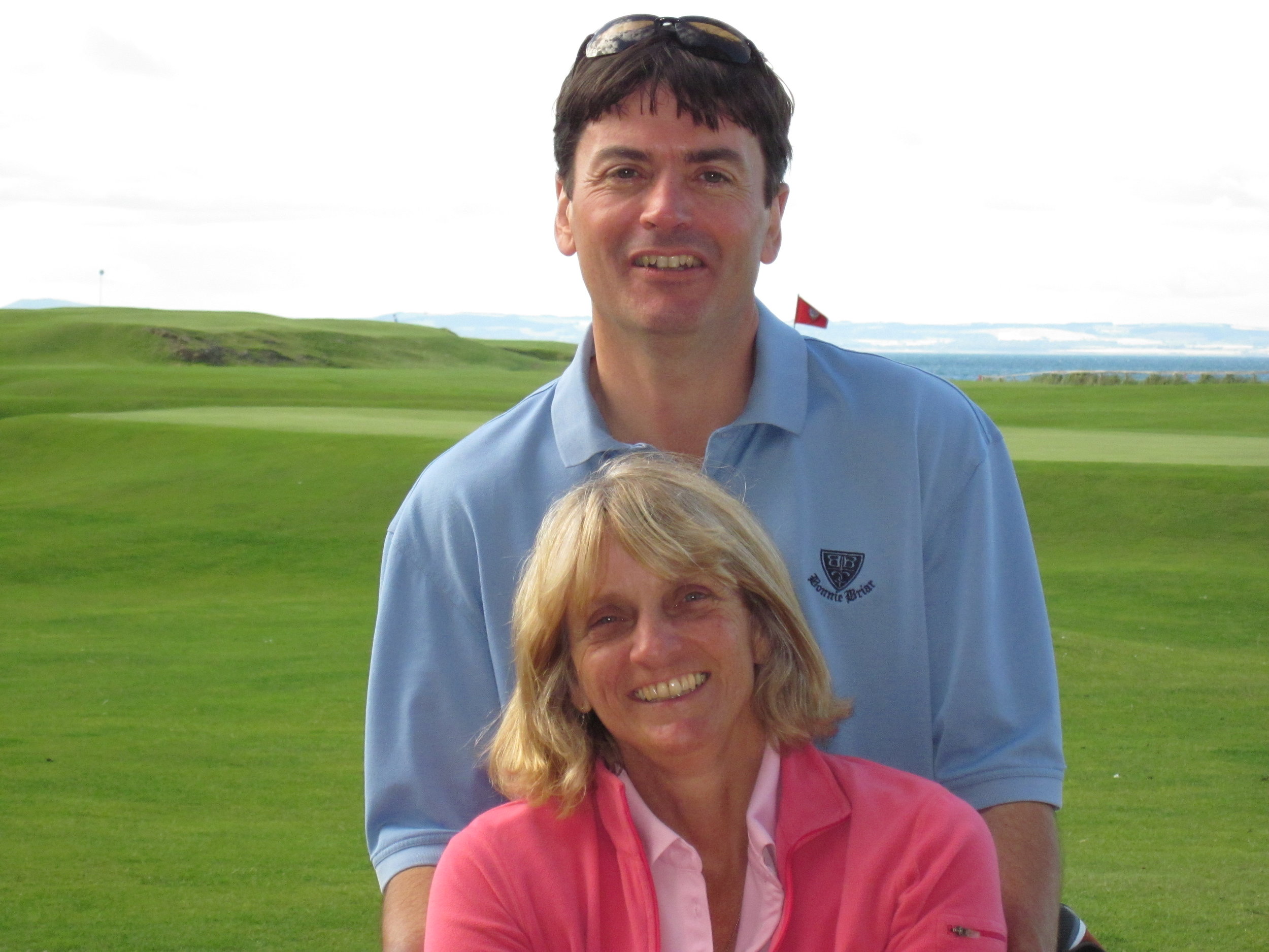 Us in 2010 with the Eighteenth flag in the background.