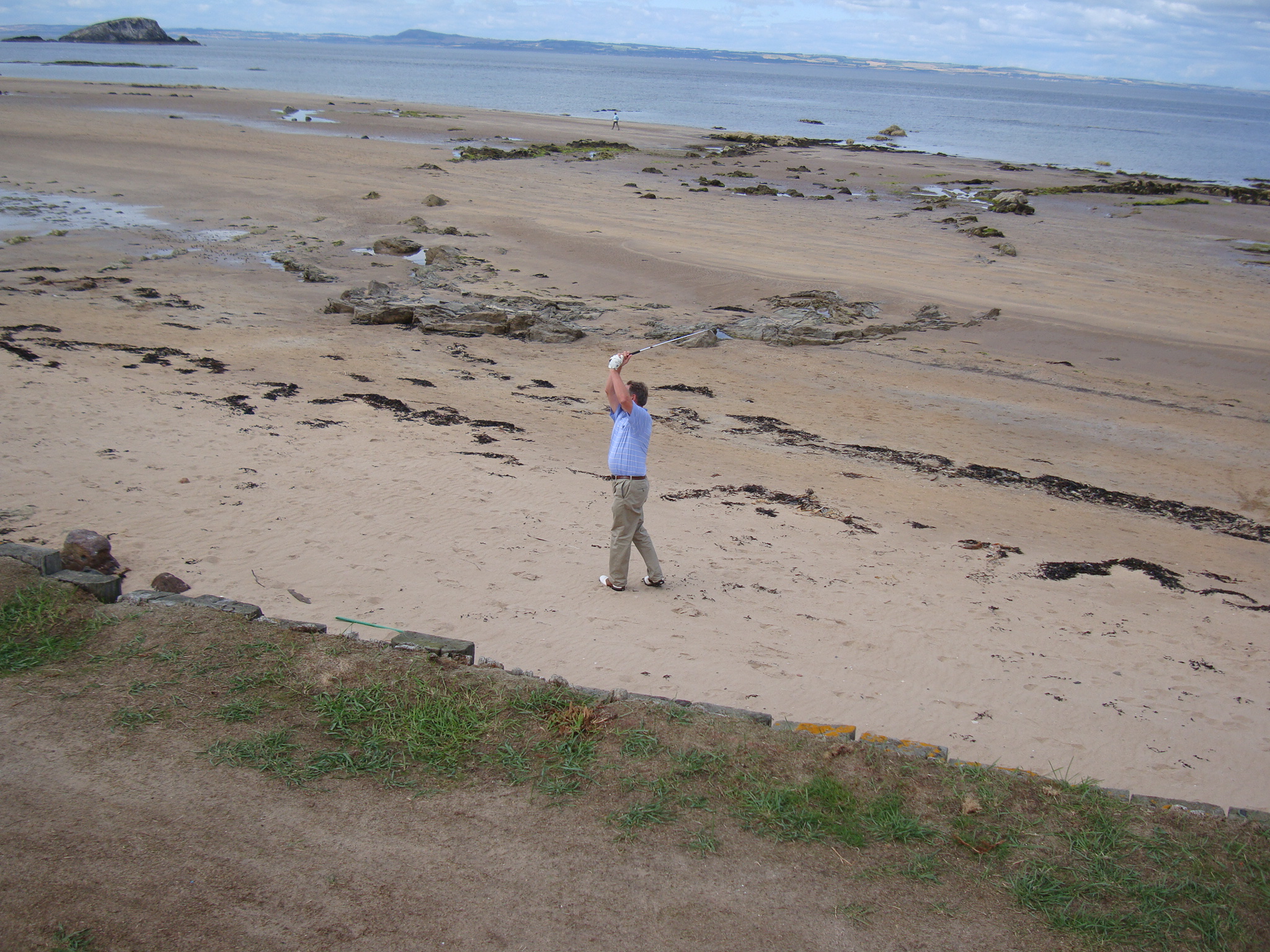 My cousin Pat's husband Alan Phillips playing from the beach at number 2 in 2010.