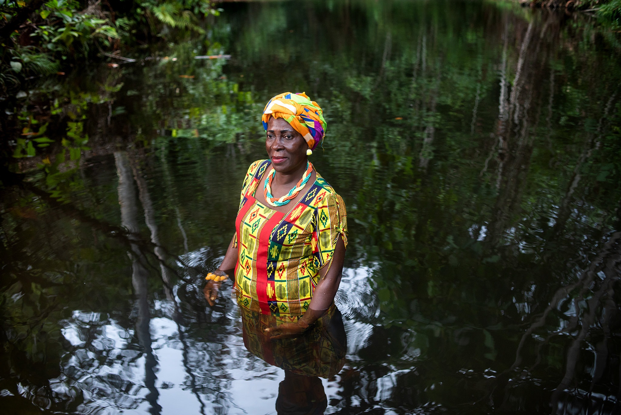 Amada Cortéz, a community leader and educator from the San Lorenzo district in Esmeraldas, bathing in the San Pedro waterfall. She is also a writer and poet, author of the book “Me Llaman la Cimarrona” (“They call me the Cimarrona”), based on African octave poems that she learned from her father. Ecuador, 2018. Credit Johis Alarcón