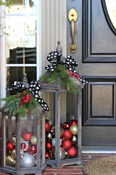 Don't want a wreath, use these wooden lanterns filled with ornaments to spruce up your front entrance.
