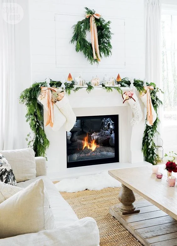 Love the white stockings and houses on the mantel. This is so elegant.