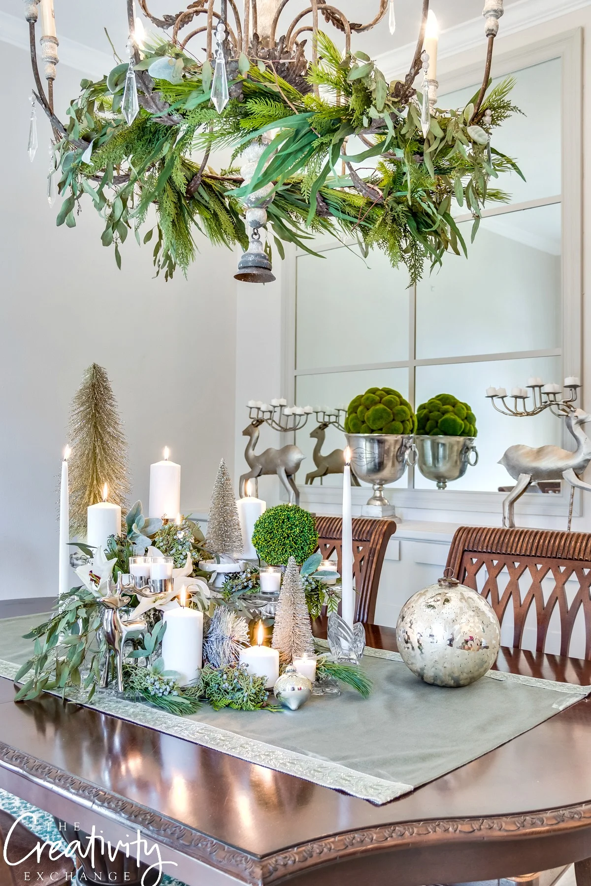 Love the different trinkets mixed with candles and greenery.