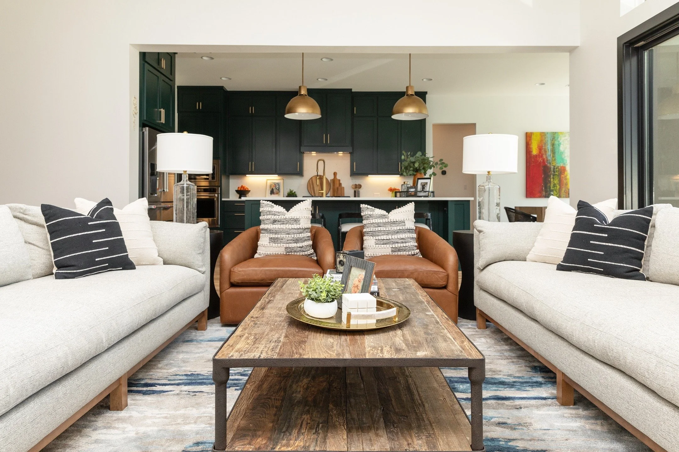 You know a living room is done right when no one wants to leave it.

Soft neutrals, warm leather, natural wood, and a fireplace that quietly steals the show. Every layer in this space was designed to feel relaxed, timeless, and effortlessly livable.
