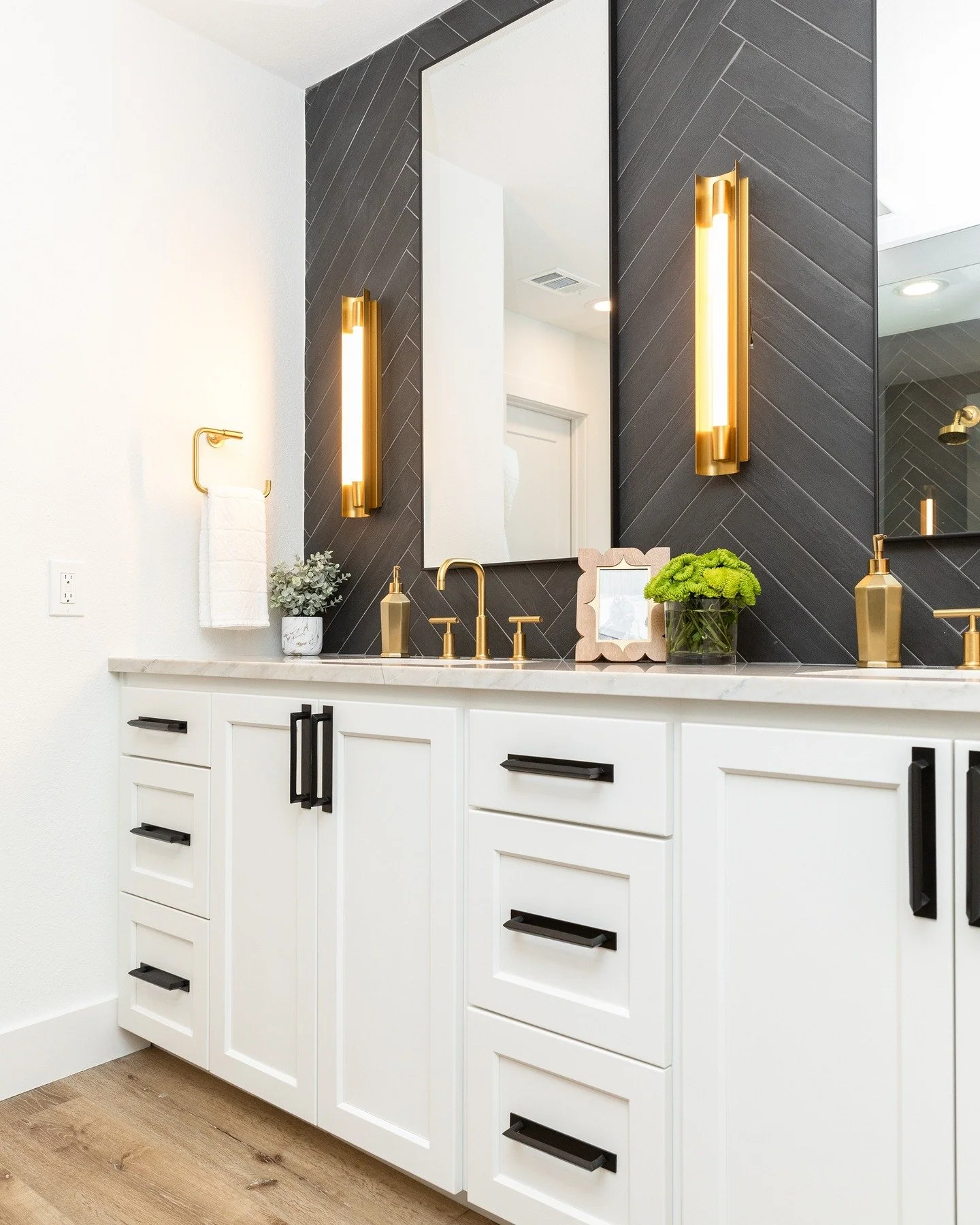 Dark, but make it elevated 🖤✨

A charcoal herringbone moment sets the tone, while warm brass layers in just enough glow to keep things feeling inviting&mdash;not heavy. Clean lines, thoughtful symmetry, and a little contrast go a long way.

It&rsquo