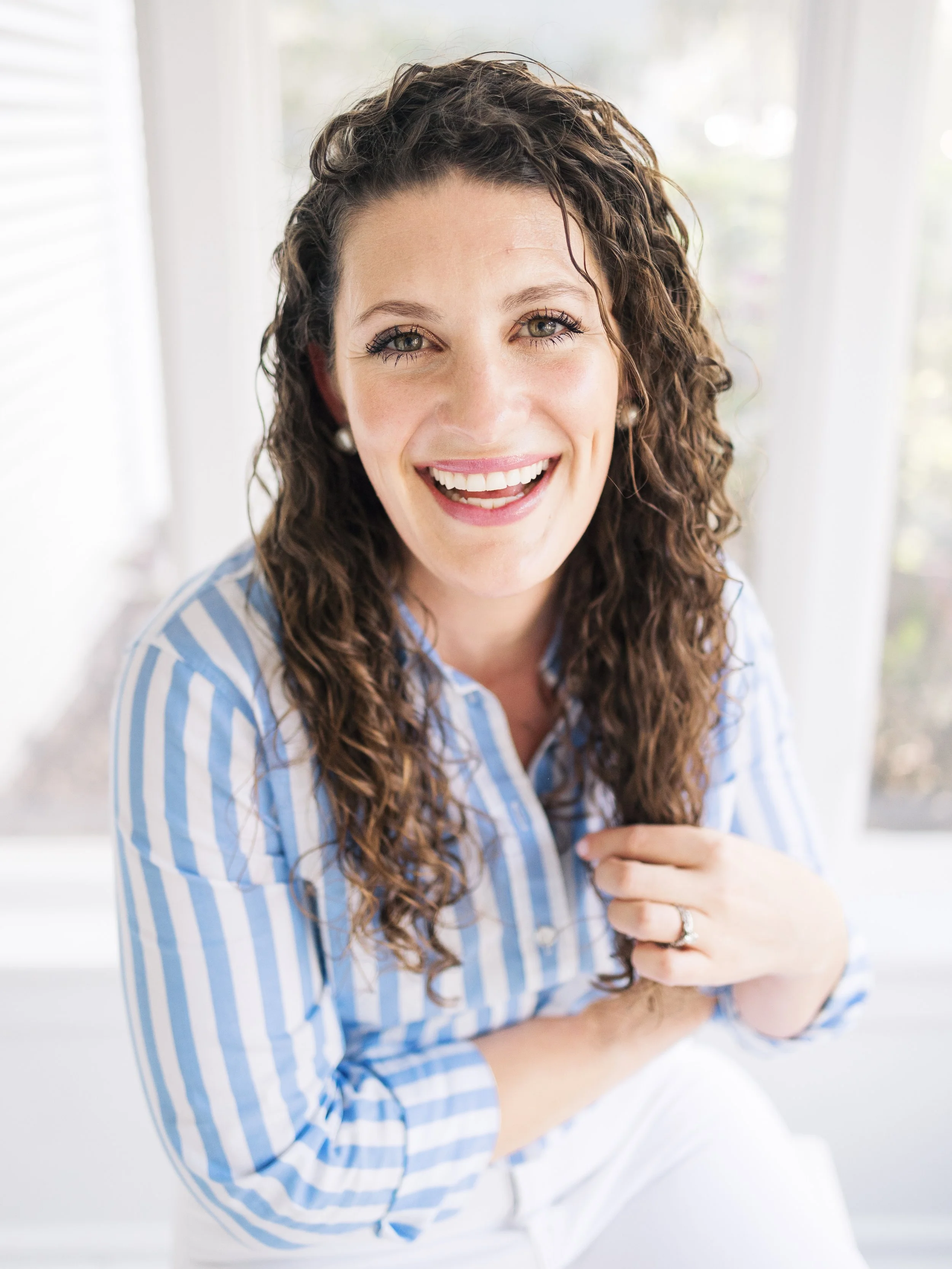 Postpartum Anxiety Therapist smiling after therapy
