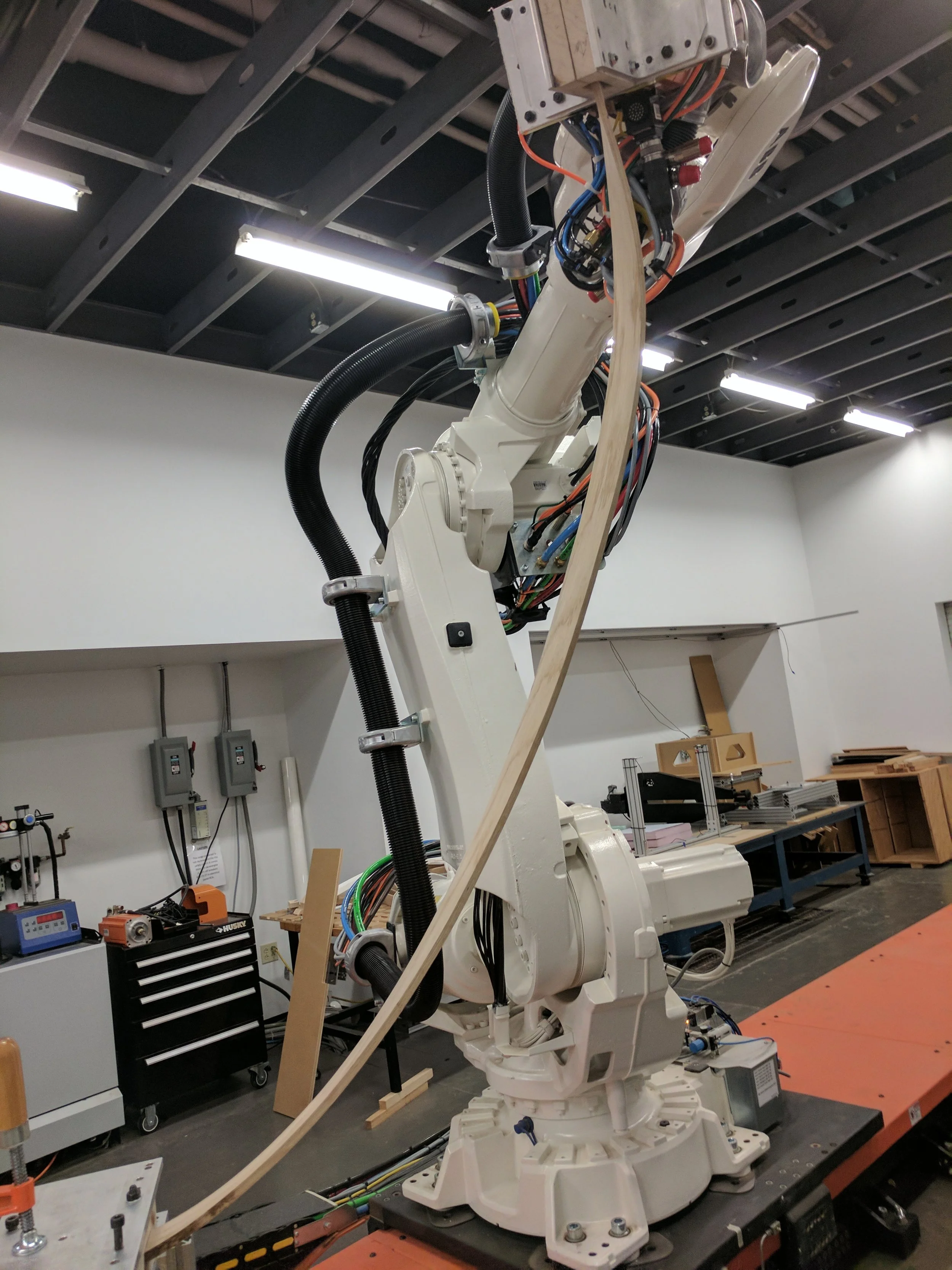Robot bending our longest piece, one of our truss crossbracing pieces which is about 6' long.
