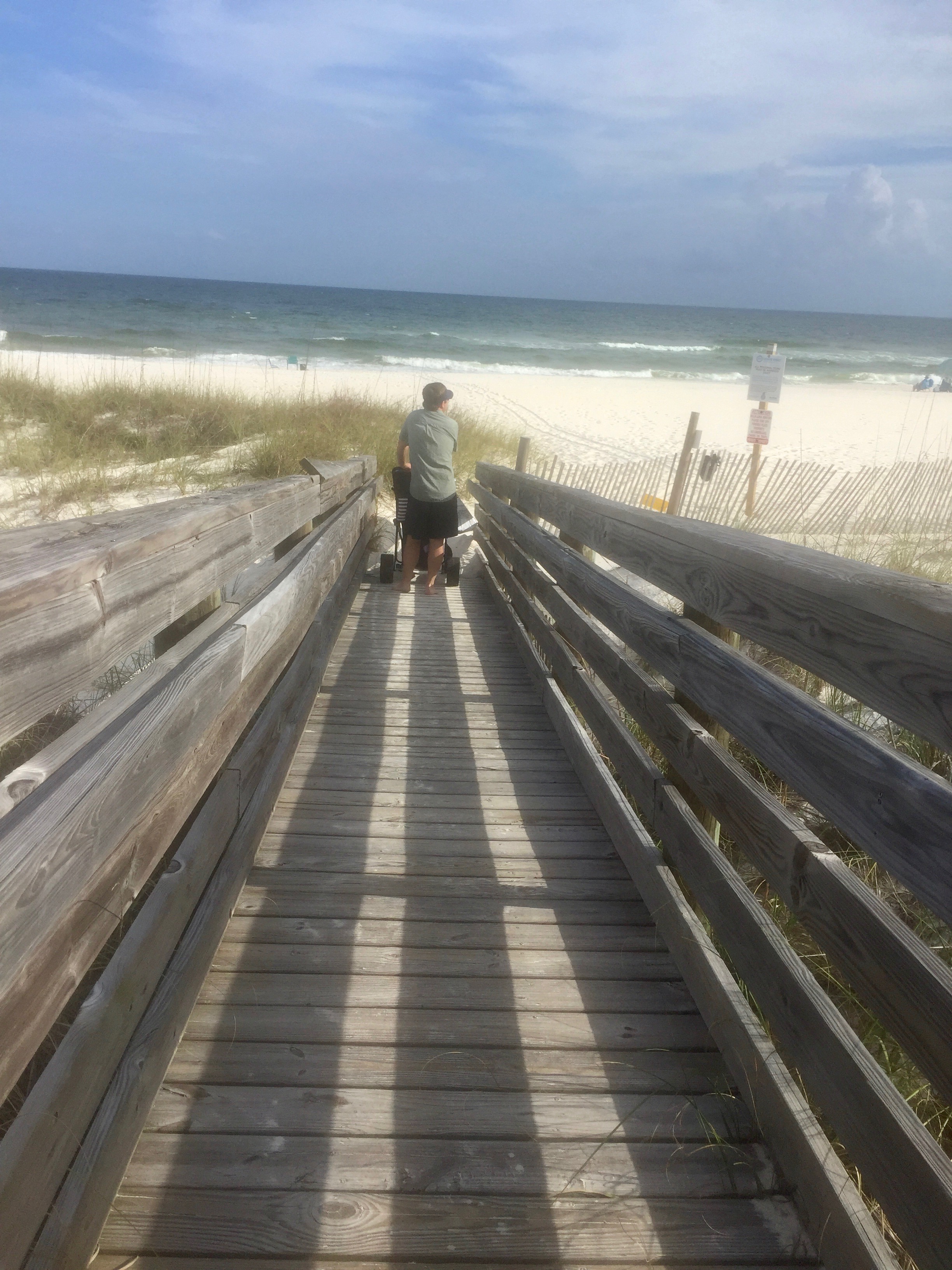 Good thing Parker doesn't read my blog posts, so he won't know I documented the break he had to take lugging the beach cart back home. :) In all honesty, that thing is heavy and HARD to pull in the sand, but so worth it.