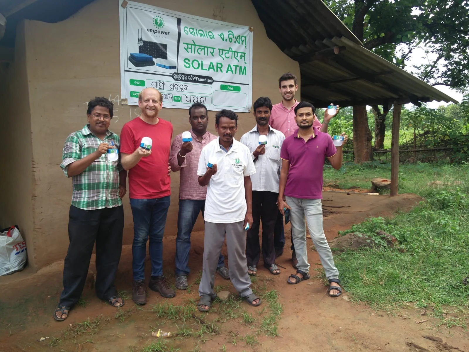 Second Franchisee Pasing Mahakud and Empower Team in front of Shop.jpg