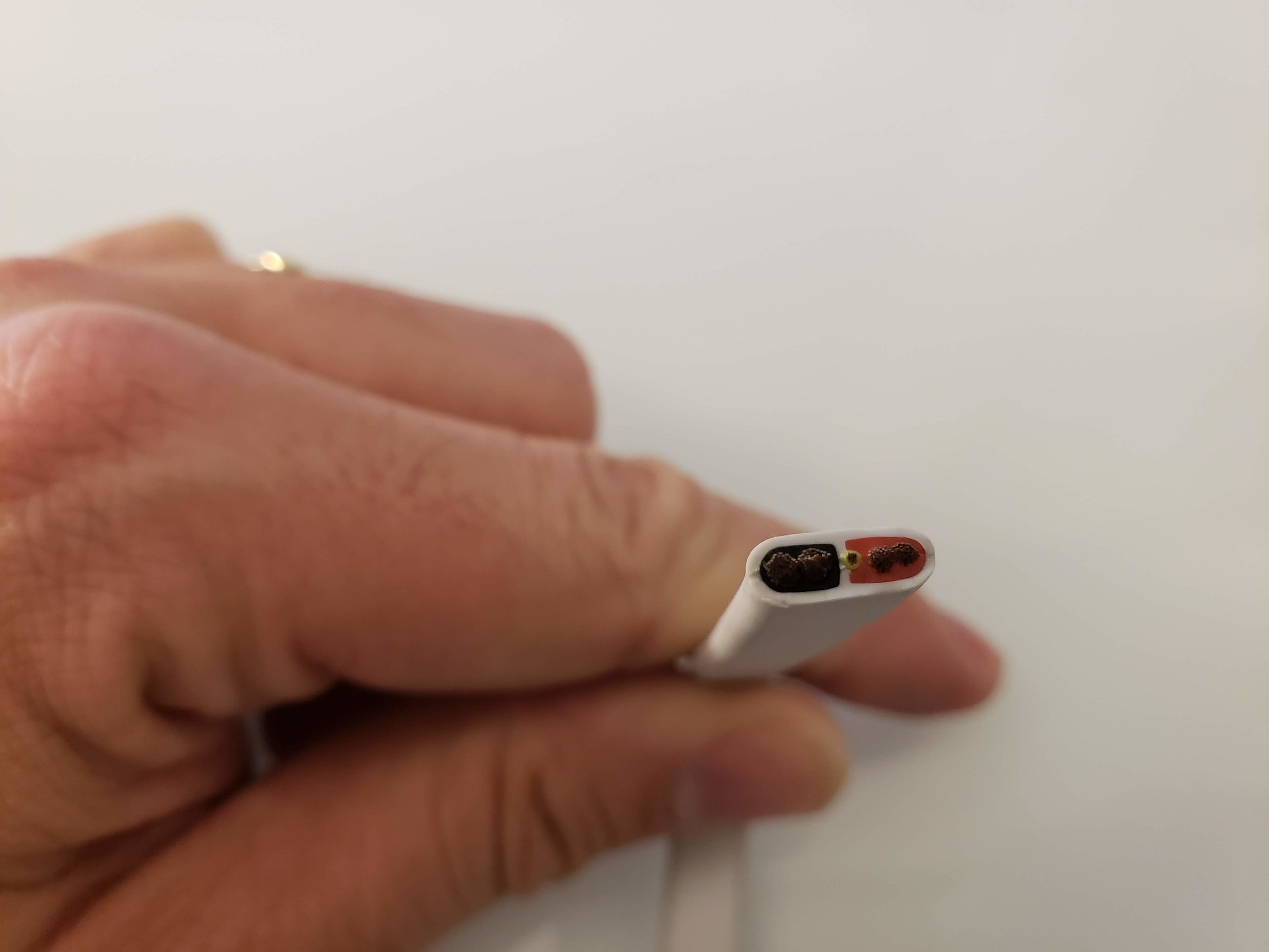 Nest Cam IQ Outdoor Installation Wiring: You can see the red, black and yellow wire in the cross section.