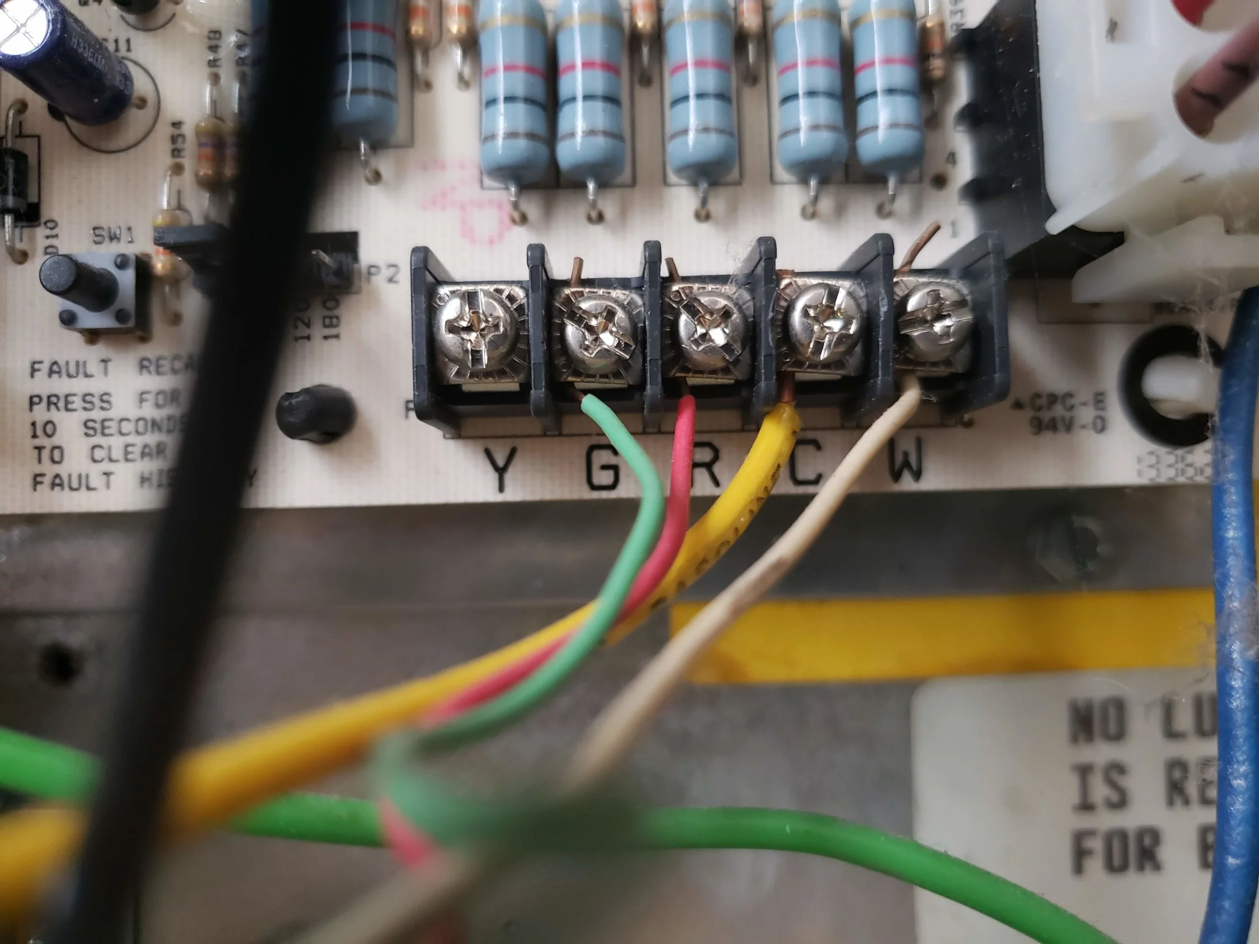 Here we show the thermostats terminals where C wiring would be attached to the Nest Thermostat. Each HVAC system is slightly different, but the lettering conventions are the same across the majority of HVAC systems. This HVAC system has a C wire installed, it’s the yellow wiring shown on the C (Common) wire terminal.