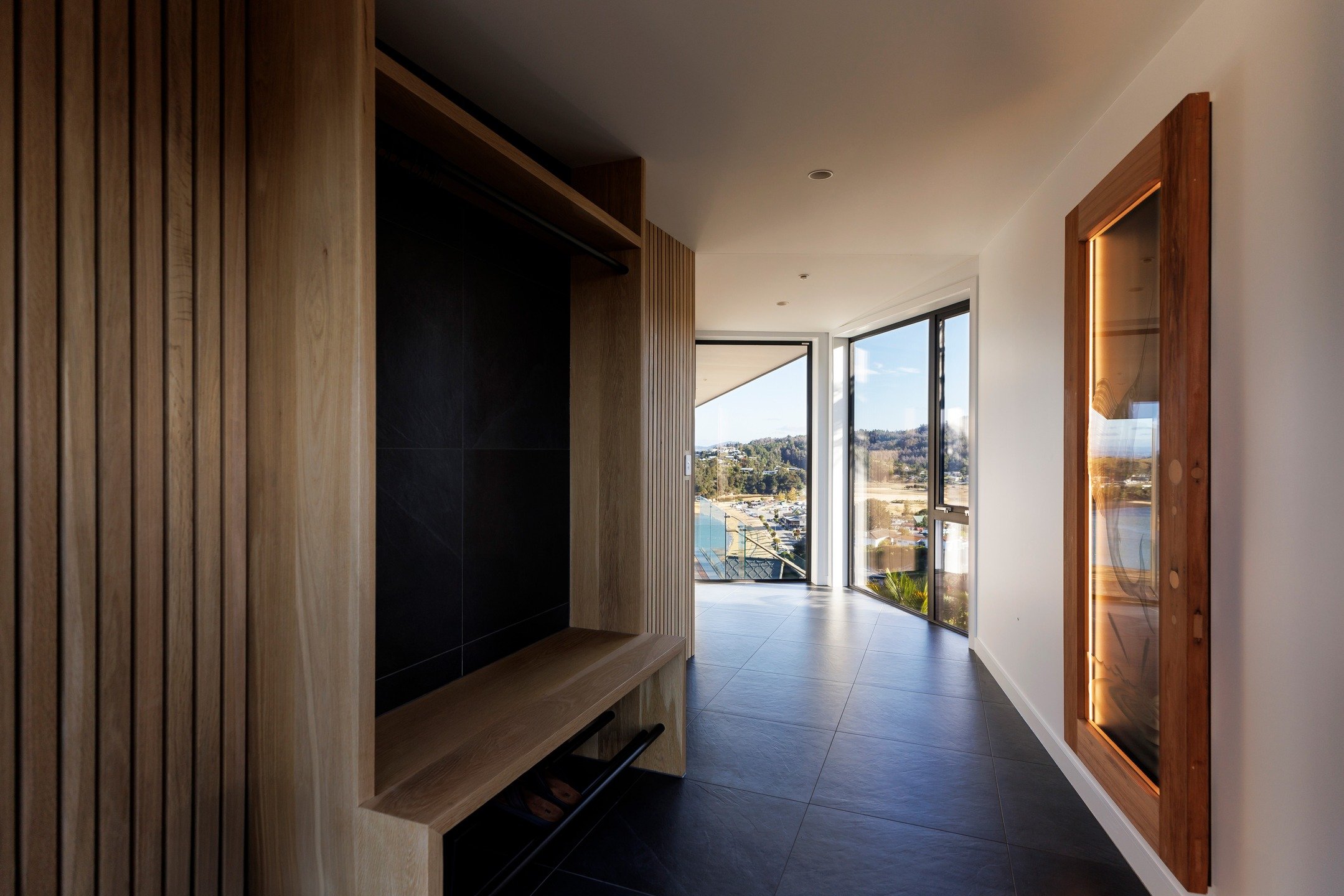 Welcome home. Upon entering a house we like to create a space to decompress. A transitional space between inside and out. A space to gather your thoughts, shed some layers and at this time of year...get cozy.

This entrance has it all, coat &amp; sho