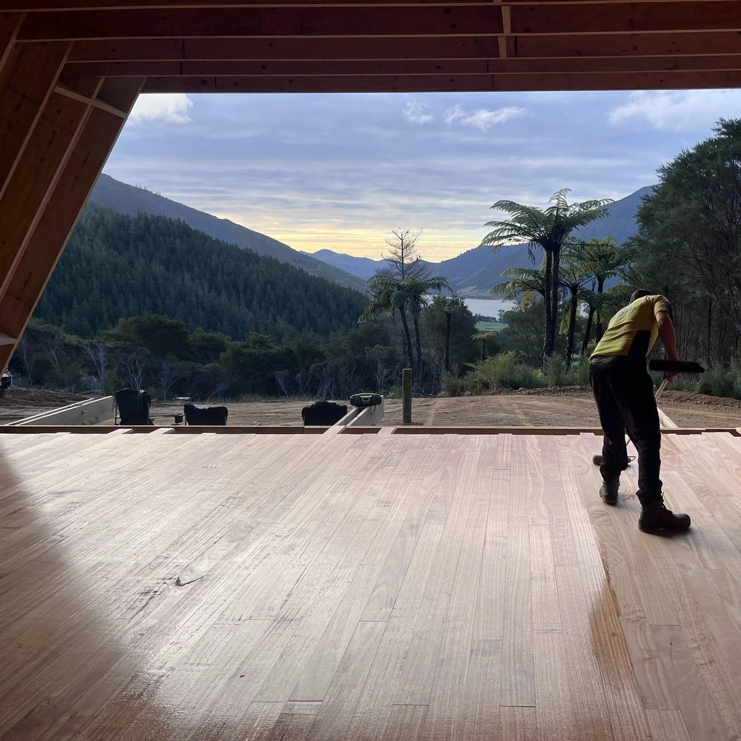 Not a bad spot to be working on site! This is the living room view from our Triangle House in the Marlborough Sounds. A first coat of oil going onto the locally sourced and milled Eucalyptus flooring.

#architecturenz #sourcelocal #sustainability #af