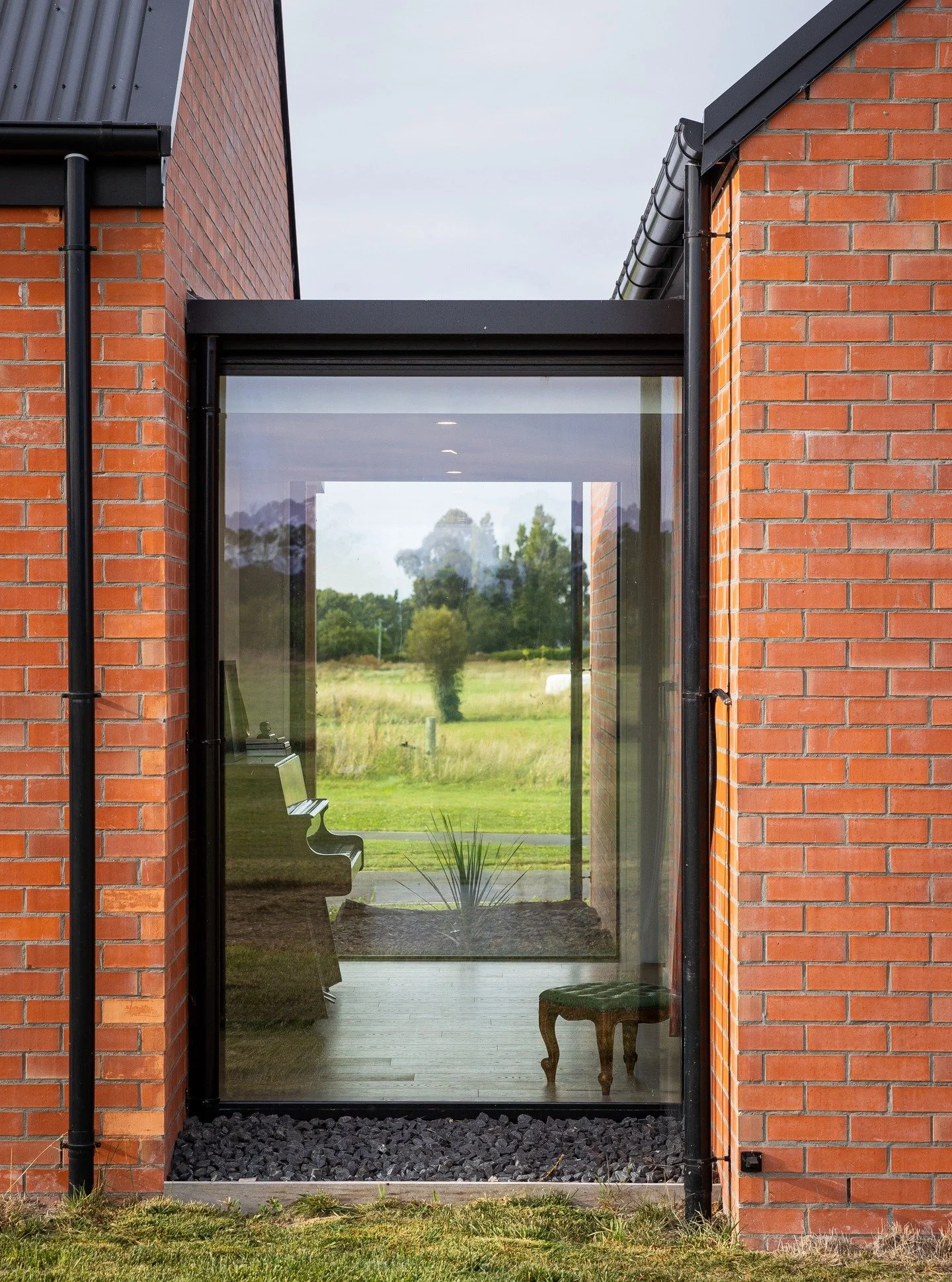 Design Detail - Lincoln Farmhouse - 'Glazed Linkways' - This design idea started as a way to spatially separate the brick gable forms. By the end of the design process it was so much more. These glazed zones provided transitional spaces within the ho