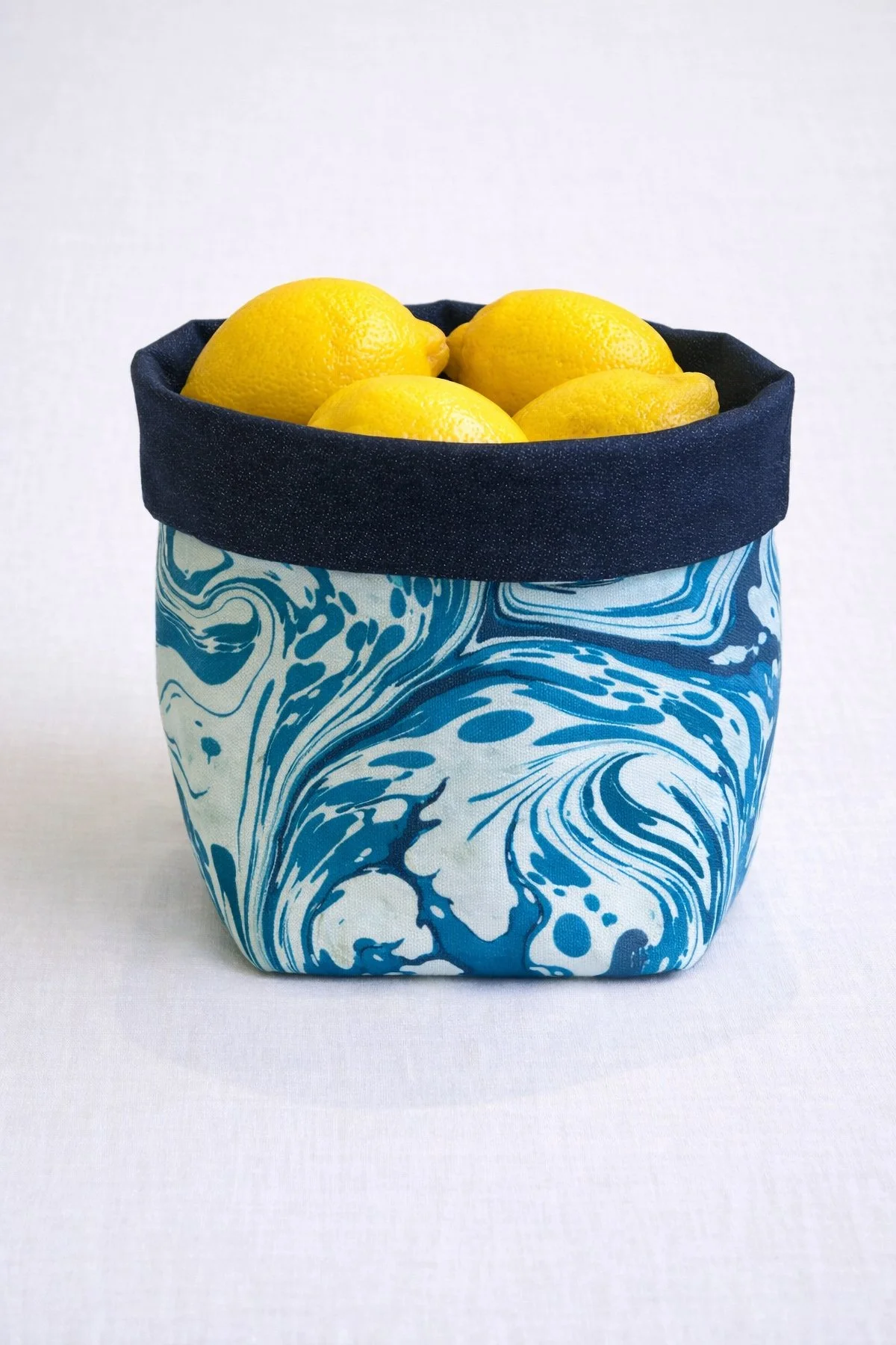 Celebrating art and everyday beauty with handmade marbled textiles crafted in Florence. Artisan cotton decor inspired by traditional paper marbling.