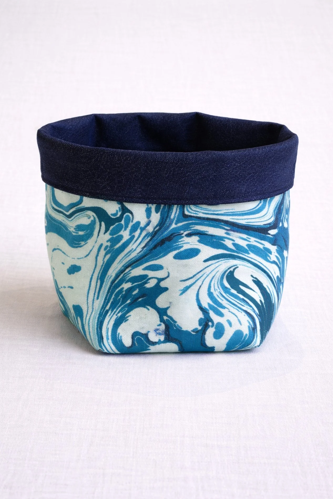 Coastal inspired marbled fabric home decor basket, made in Tuscany
