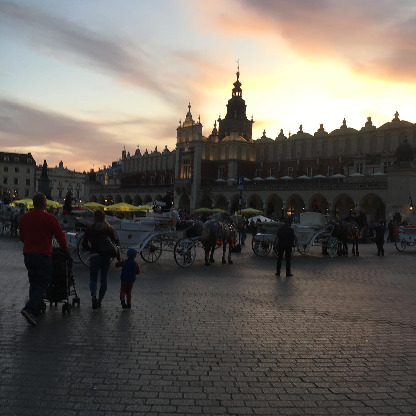 Sun going down on the main square in Krakow. Largest medieval square in Europe, 9.4 acres.