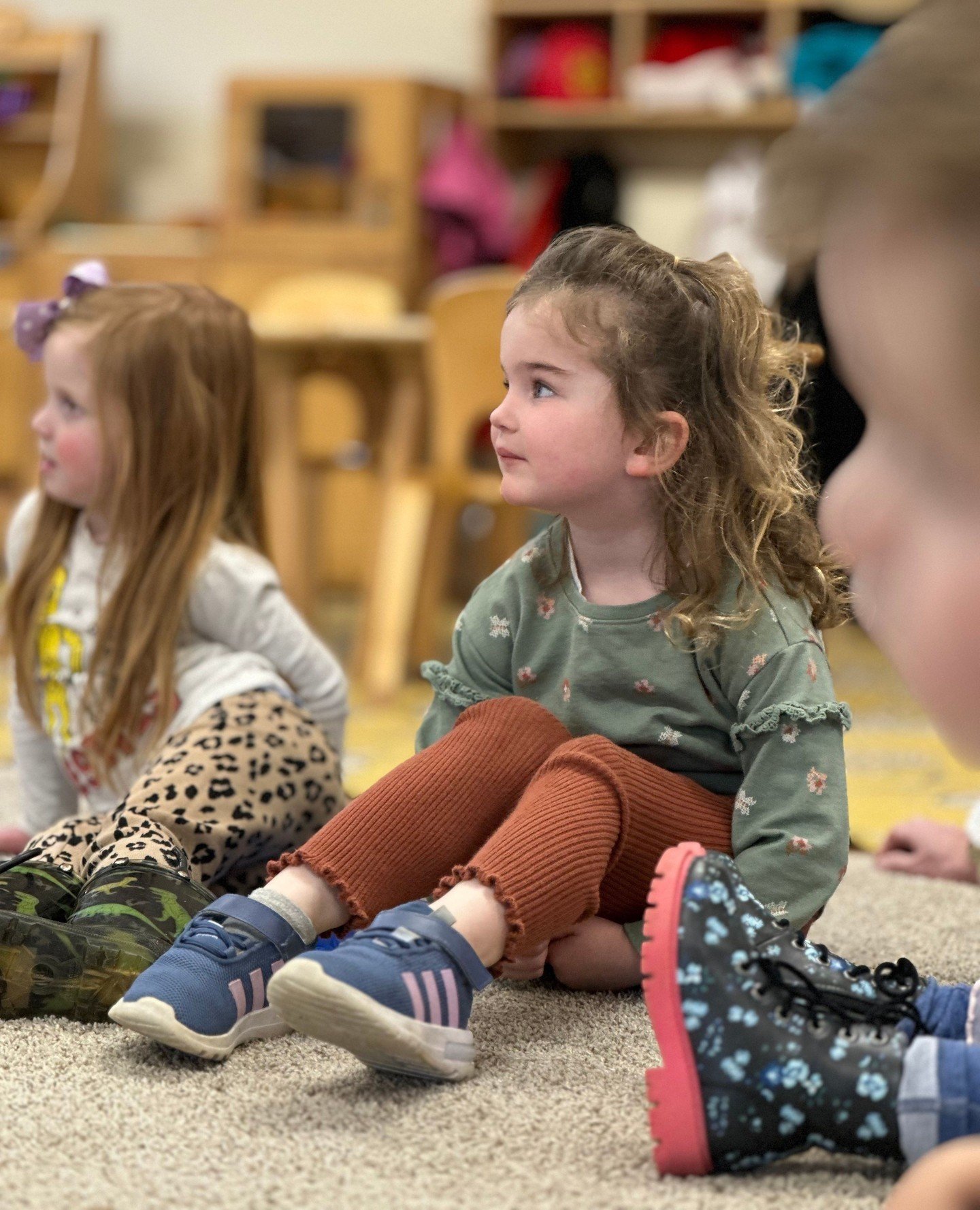 When not distracted, 3 year olds demonstrate active listening skills, focusing eyes, bodies, and attention on the person speaking.