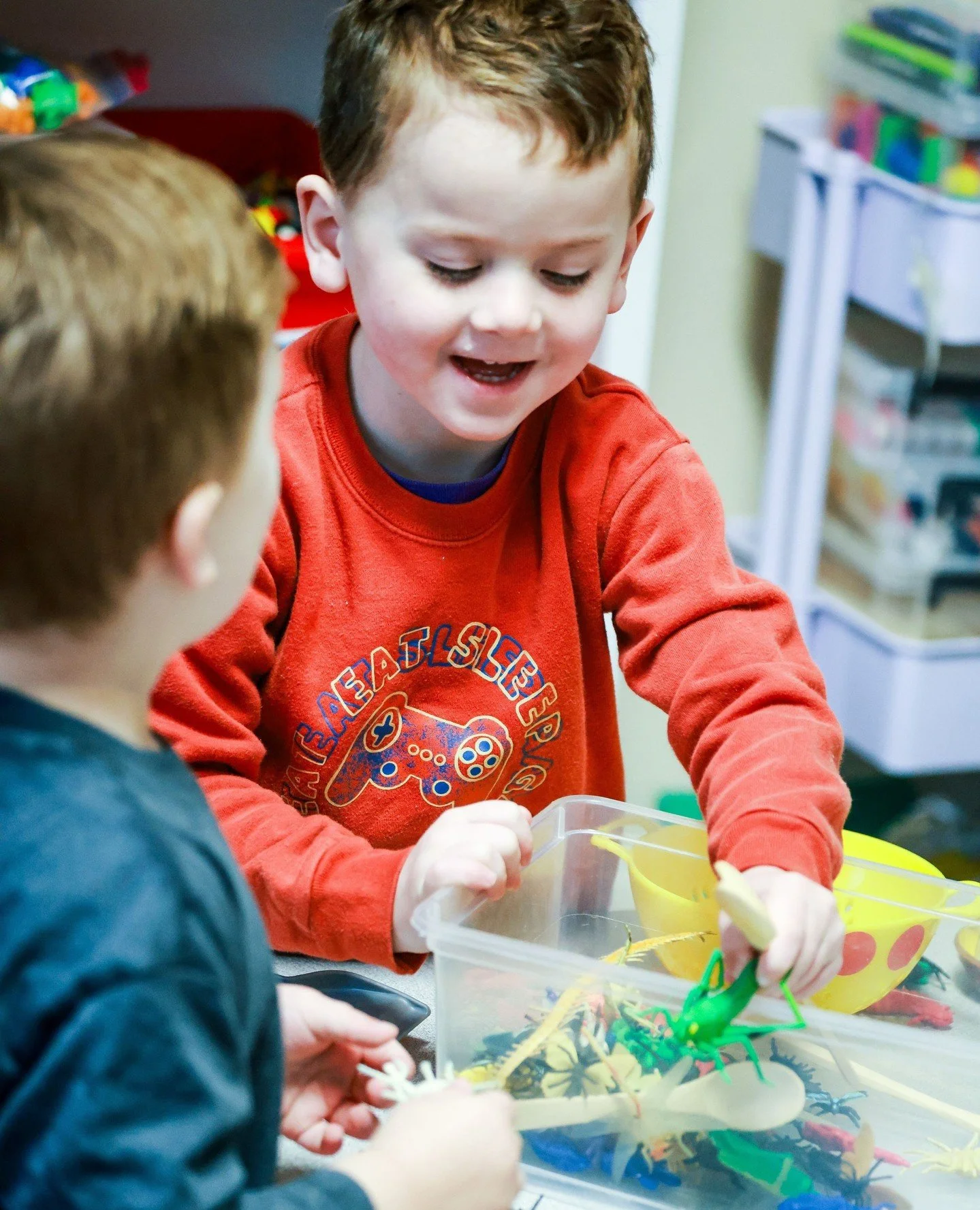 Tactile exploration offers a calming effect, improving focus during group play and opening communication skills. During this particular play, we were exploring bugs.  A story was told about how a grasshopper landed on Dad's head and how everyone resp