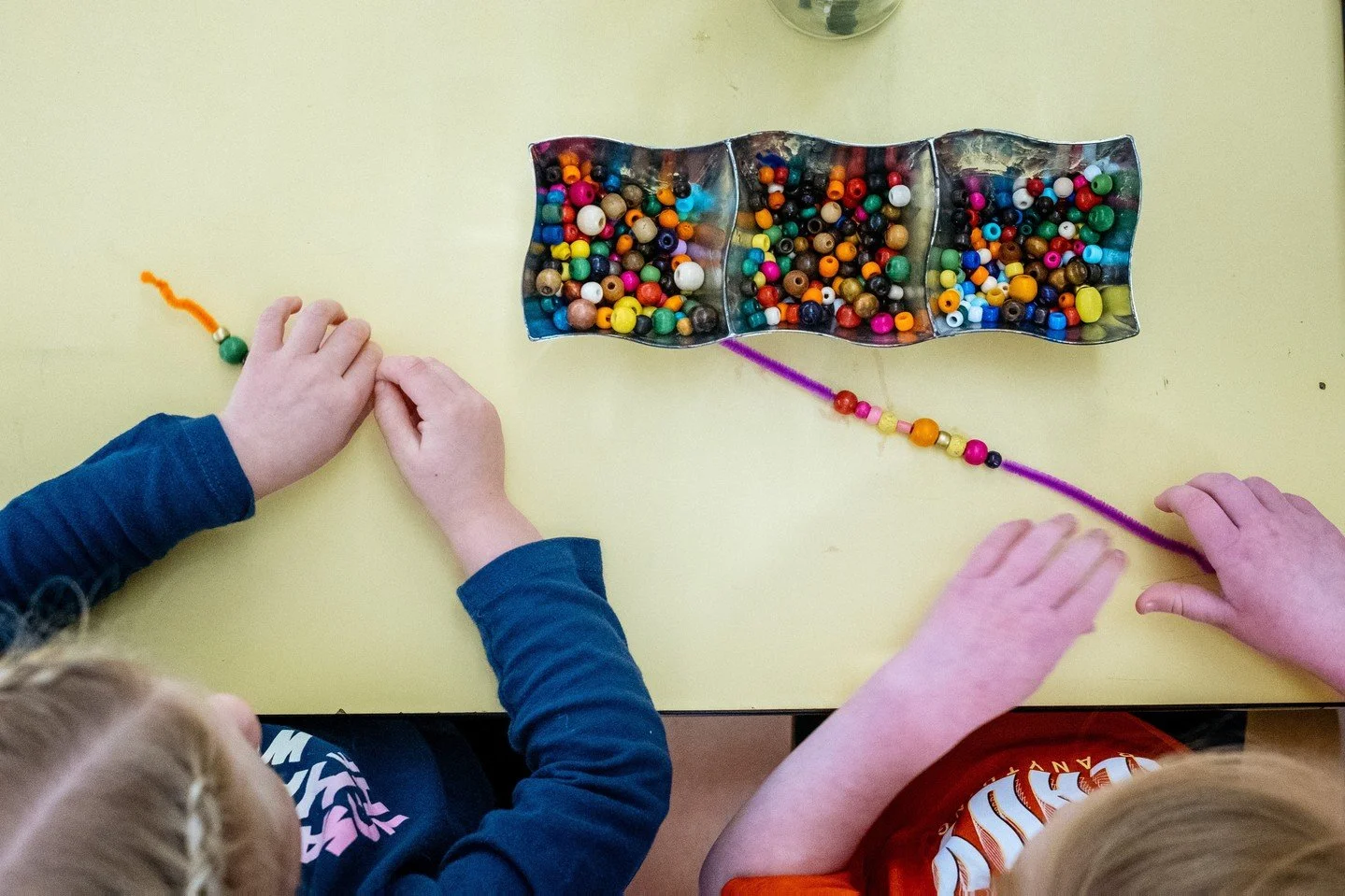 Fine motor precision is crucial for early writing, drawing, using child-safe scissors, and manipulating classroom materials, which directly influences school performance.