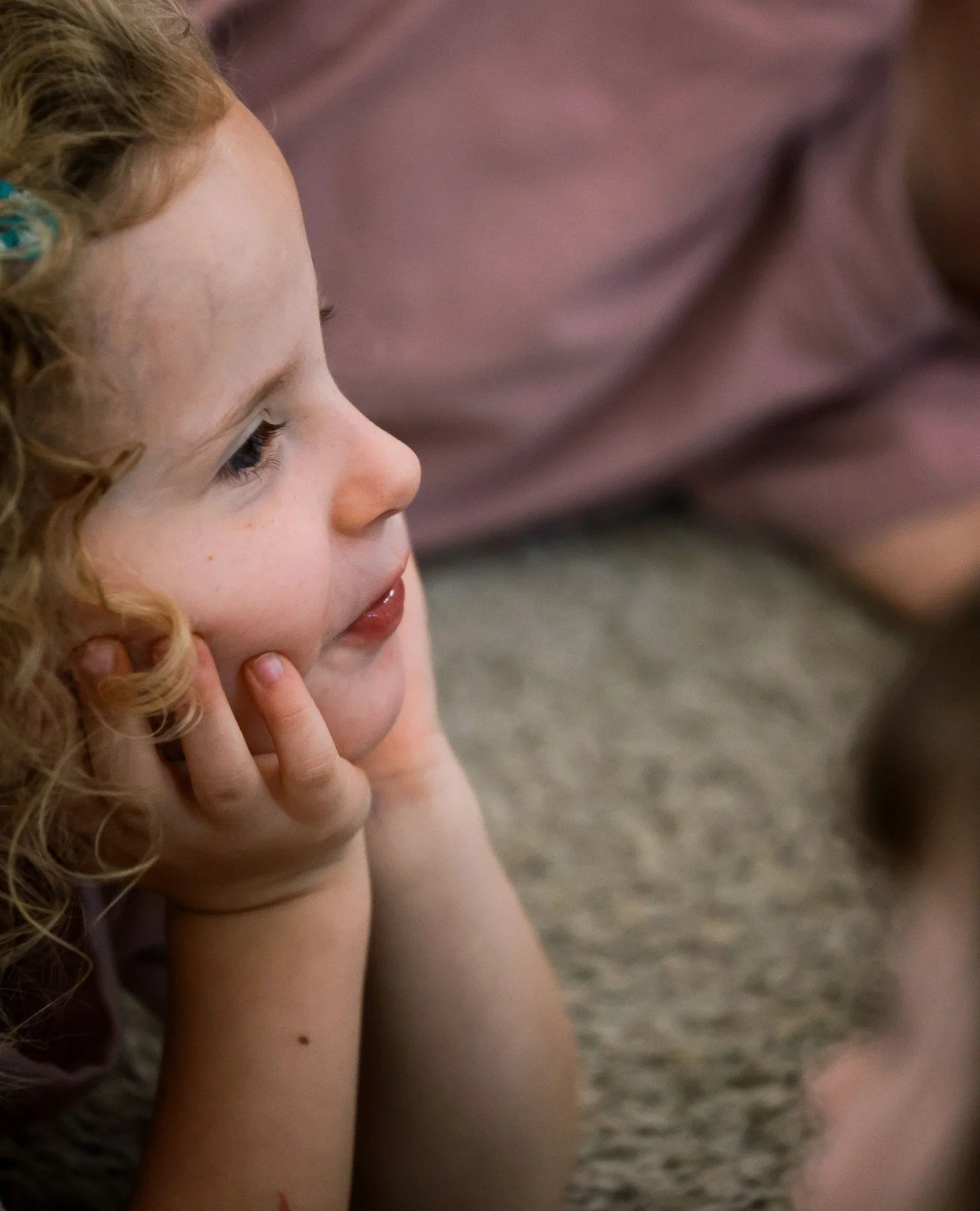 Lying on your stomach during story time builds core body strength, improves focus, and supports sensory regulation.