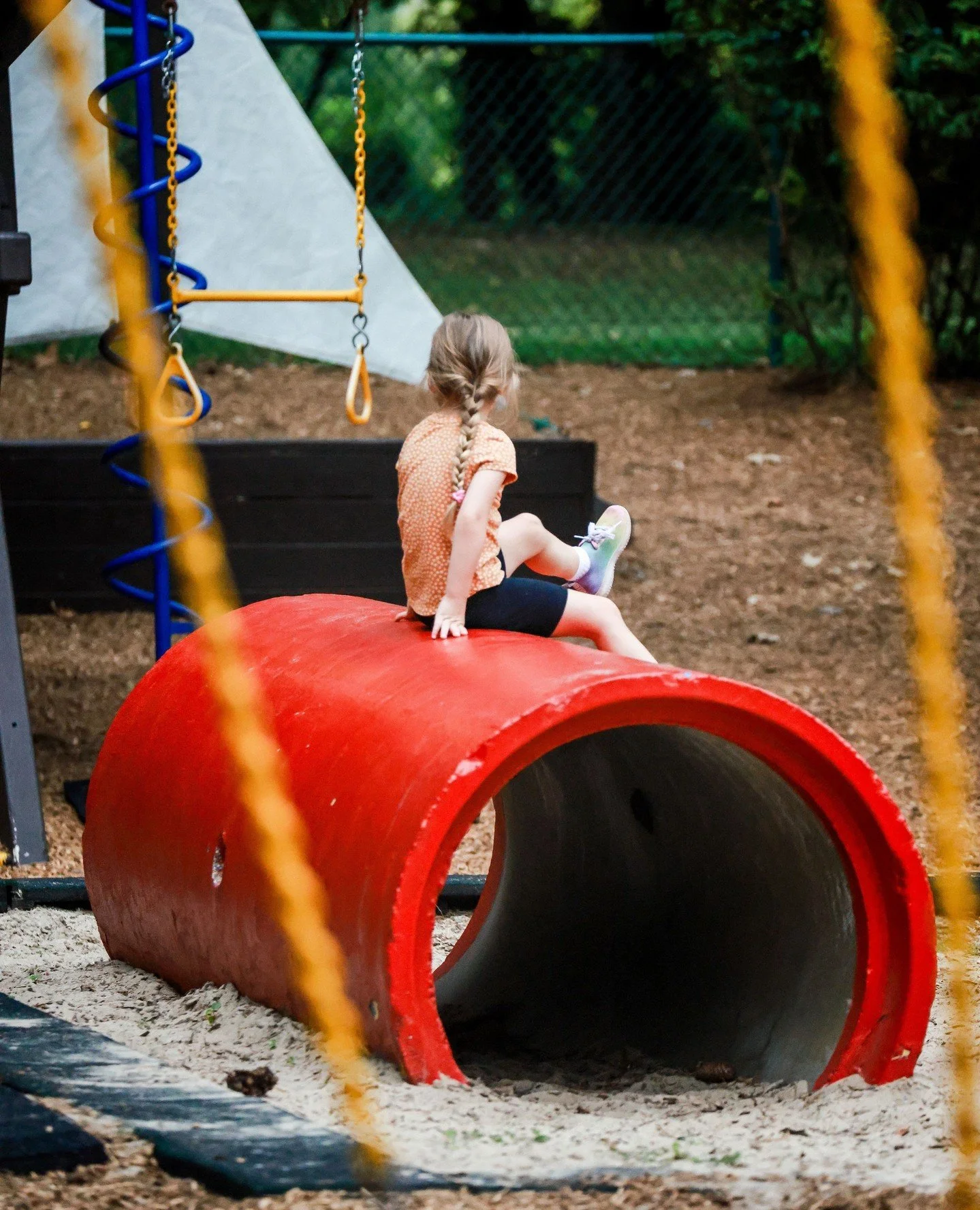 Independent play is figuring out how to navigate a climbing wall, balancing along a log, or coordinating their body to build momentum on a swing.
