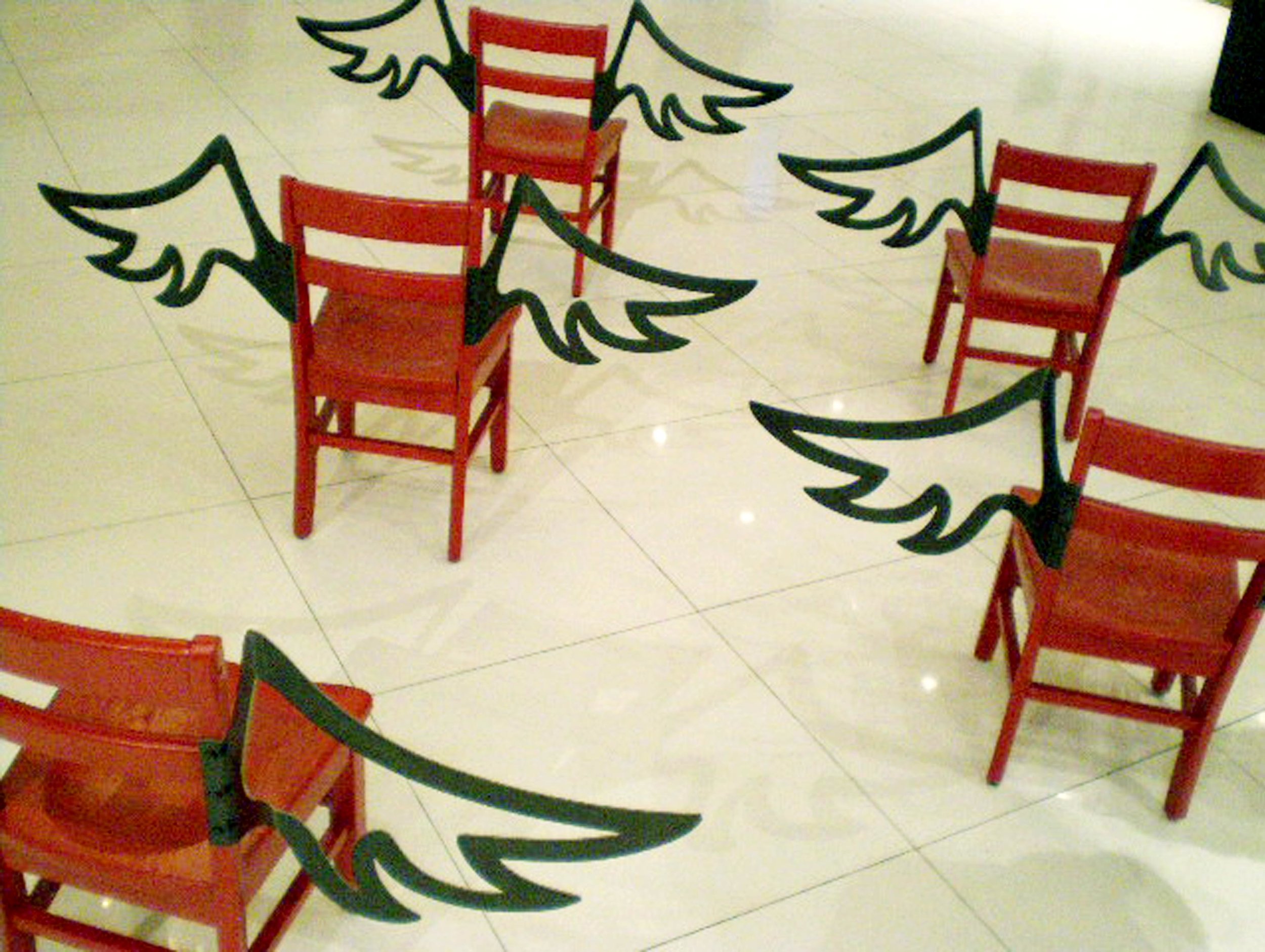    Good Intentions Aren't Enough   Mixed Media Installation: Wooden chairs and fabricated steel wings 44in x 26.5in x 14in deep 