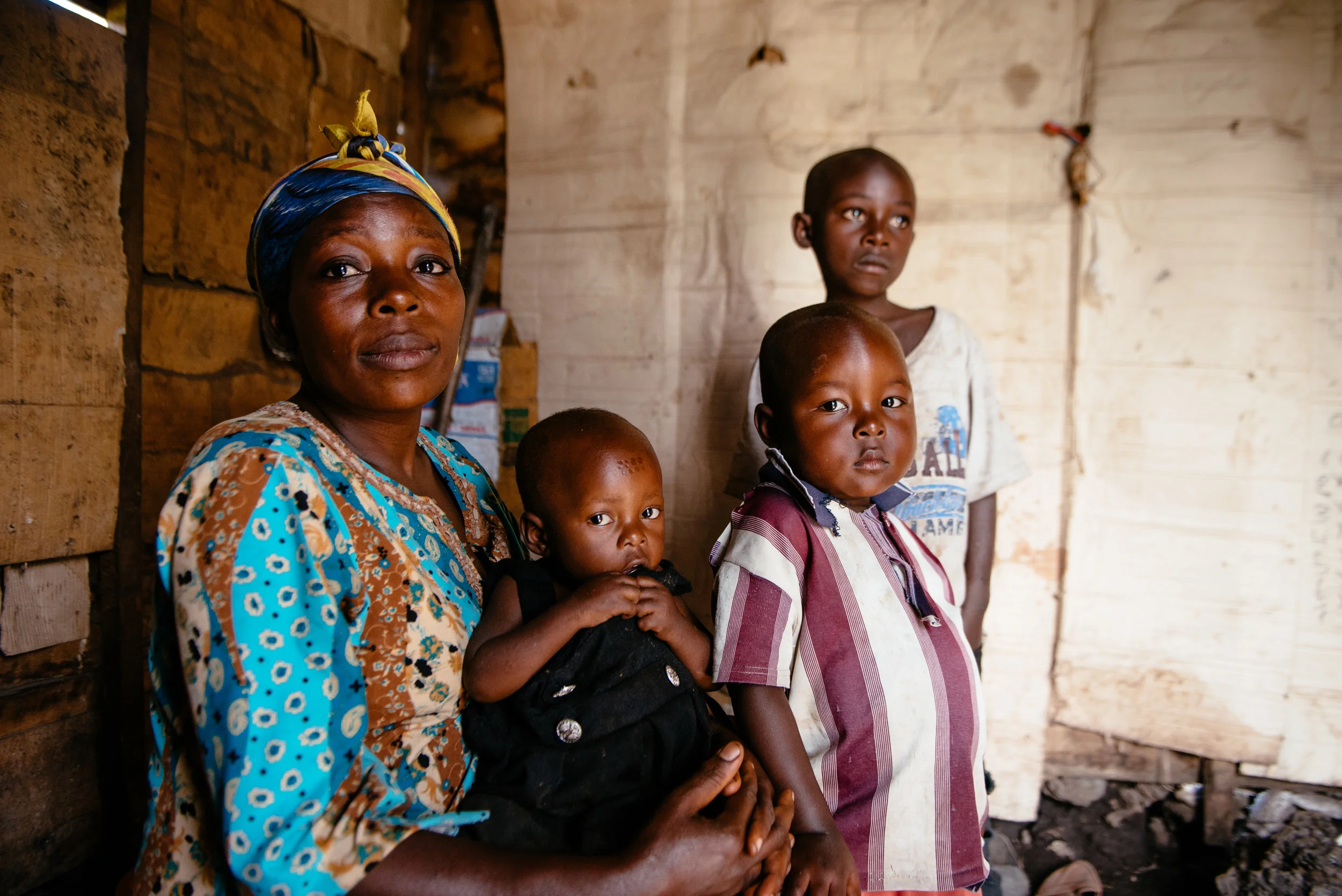 photo: Corinna Robbins for Mercy Corps, Goma, DRC. Furaha Faida, pictured here with three of her four children, fled her hometown with her children after soldiers looted their home and subjected her to violent sexual assault.