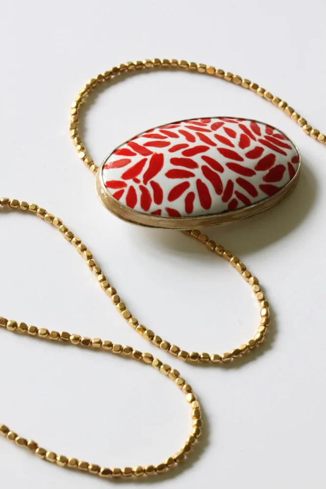Red Too copper, sterling silver, vitreous enamel, brass