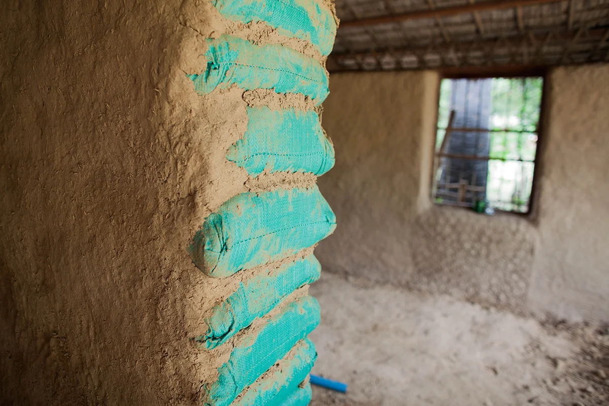 The incomplete mud-walls of the library hut.