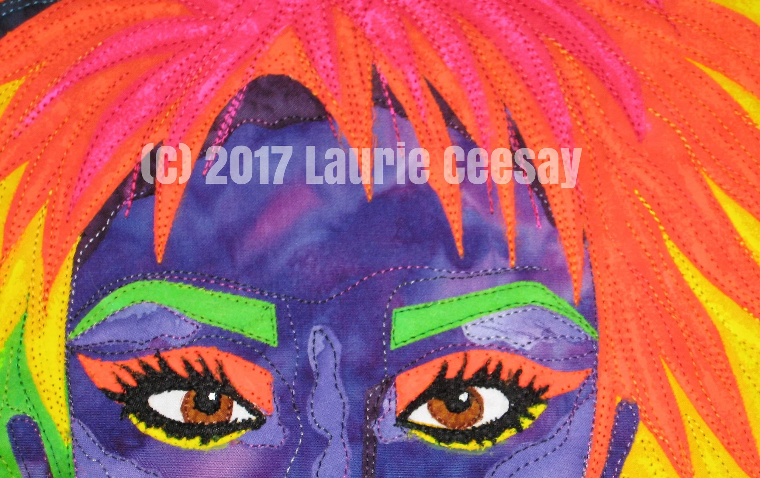 This is a close up of the face. I purchases some fabric glow in the dark paint in four colors and brush stroked the paint in the matching colors. In the dark it wasn't terribly affective but oh well. For embellishments I stayed very simply because I thought the colorful fabrics were enough. I glued dark purple rhinestones to the ear lobes for earrings and a small purple rhinestone for a nose piercing. And last, a small bit of glitter poster paint on the mouth. I chose the size of 20" square just like the Cherrywood challenges because I like the size. Ta da! She is done. I am also in the middle of making a similar more complete version of this black light glow in the dark idea for myself which I will post when it is complete.
