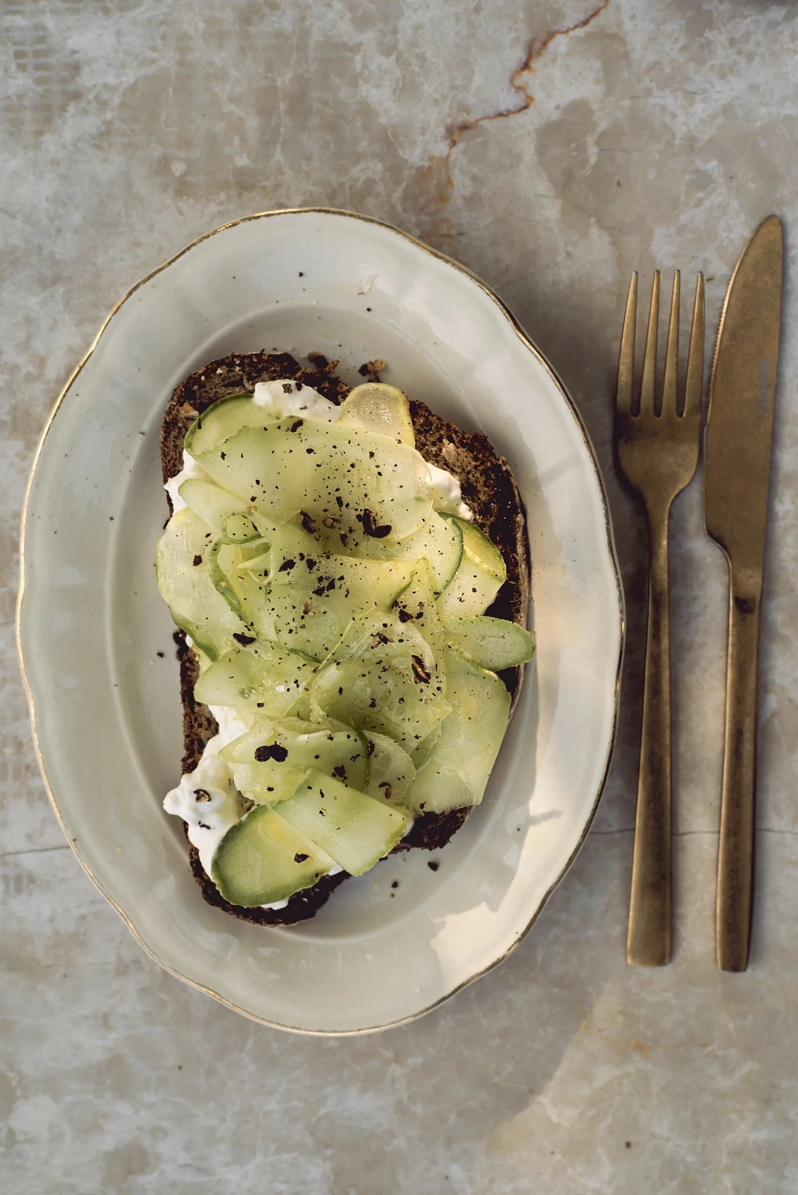 Sourdough slices with honeyed cucumber and feta cheese