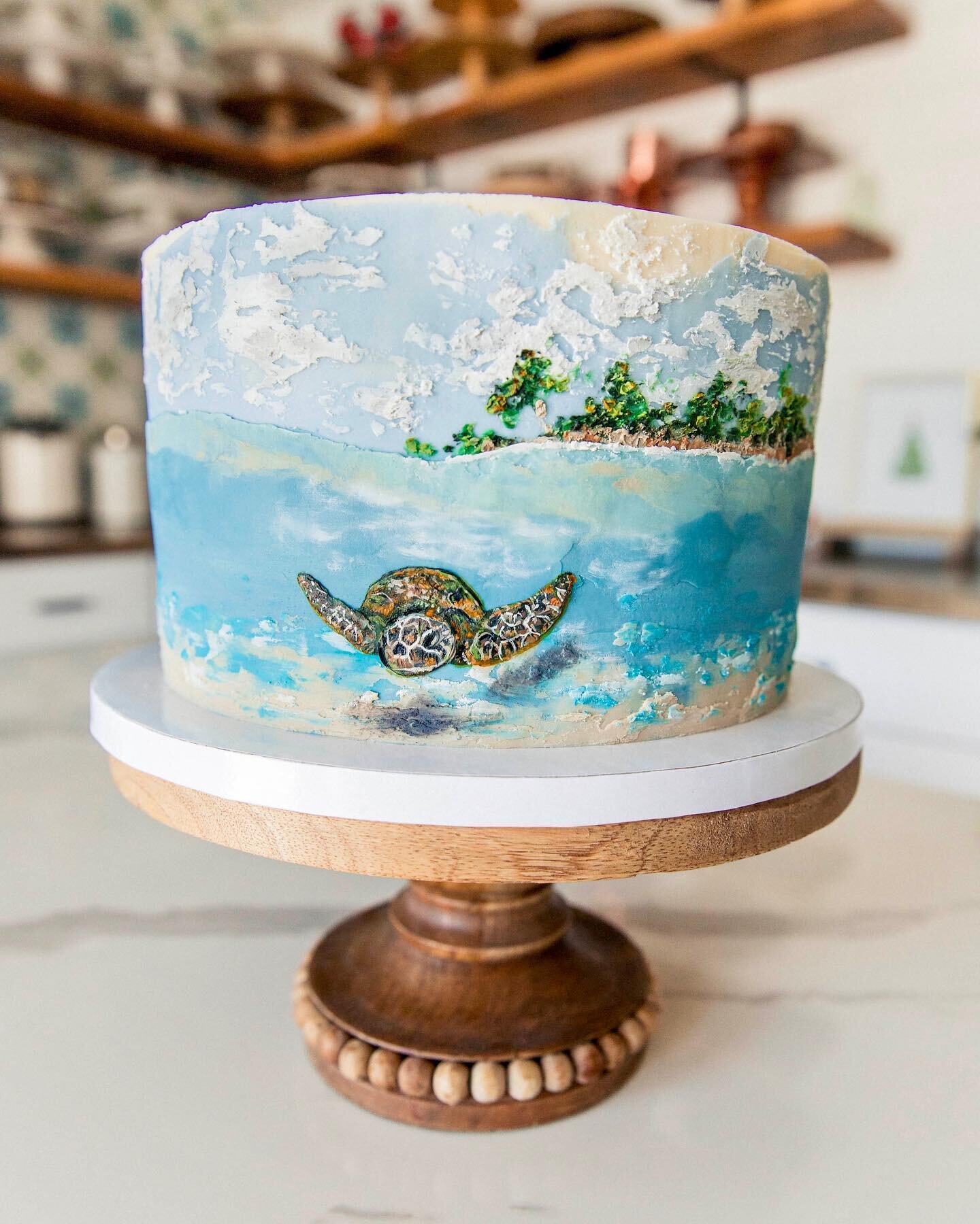 Sandy beaches and clear waters- a slice of heaven (and cake) 🌴

Made for my friend, Becca, for her birthday.

All buttercream, painted with a palette knives and artist brushes. I used @colour.mill oil-based tints. They&rsquo;re my absolute favorite!